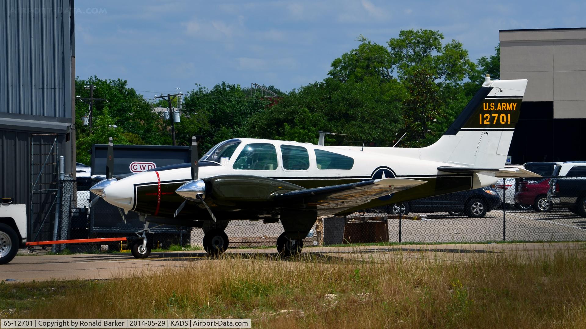 65-12701, 1965 Beech B-55 Baron (T-42A) C/N TF-23, Aircraft being towed Cavanaugh Flight Museum Addison, TX