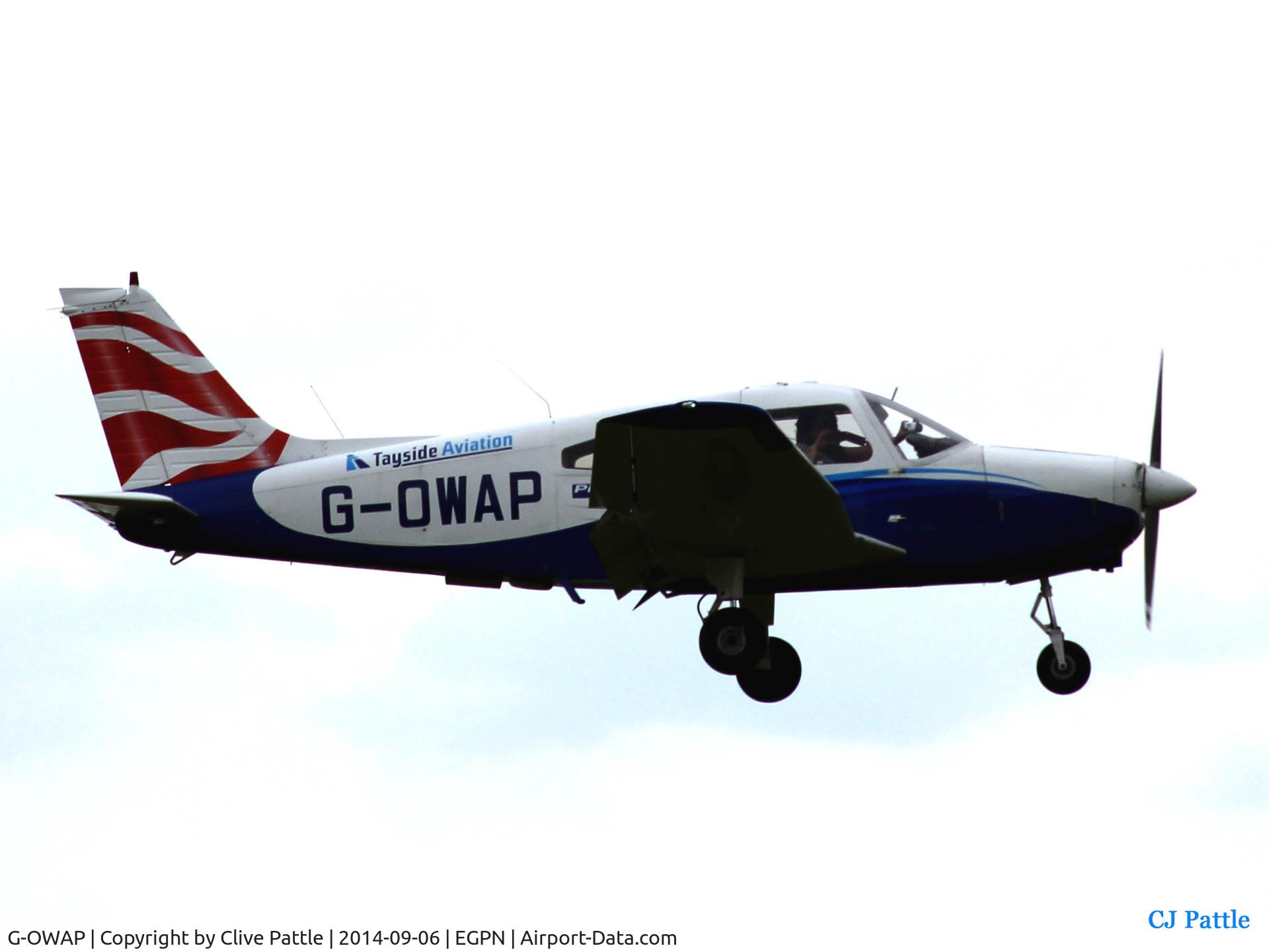 G-OWAP, 1977 Piper PA-28-161 Cherokee Warrior II C/N 28-7816314, Landing at Dundee with passenger taking photos