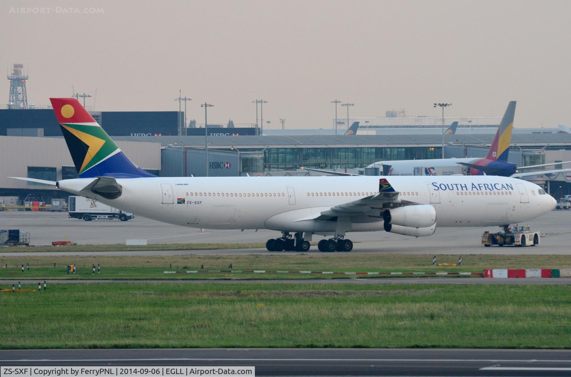ZS-SXF, 2005 Airbus A340-313E C/N 651, South African A343 being towed to its gate.
