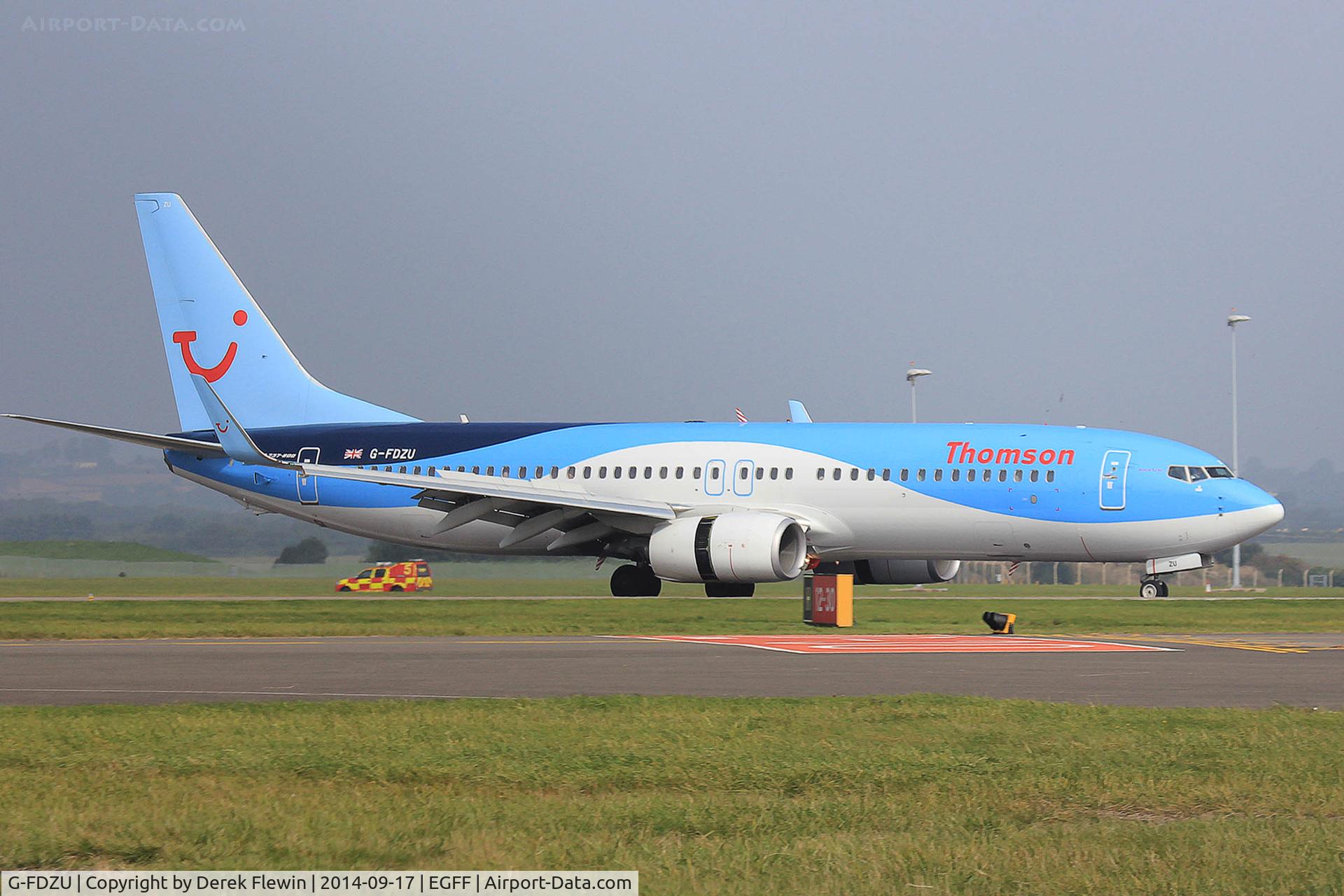 G-FDZU, 2011 Boeing 737-8K5 C/N 37253, 737-8K5, Thomson Airways, call sign Thomson 633, previously N1796B, seen landing on runway 12 at EGFF, reverse thruster doors open, out of Palma Mallorca.