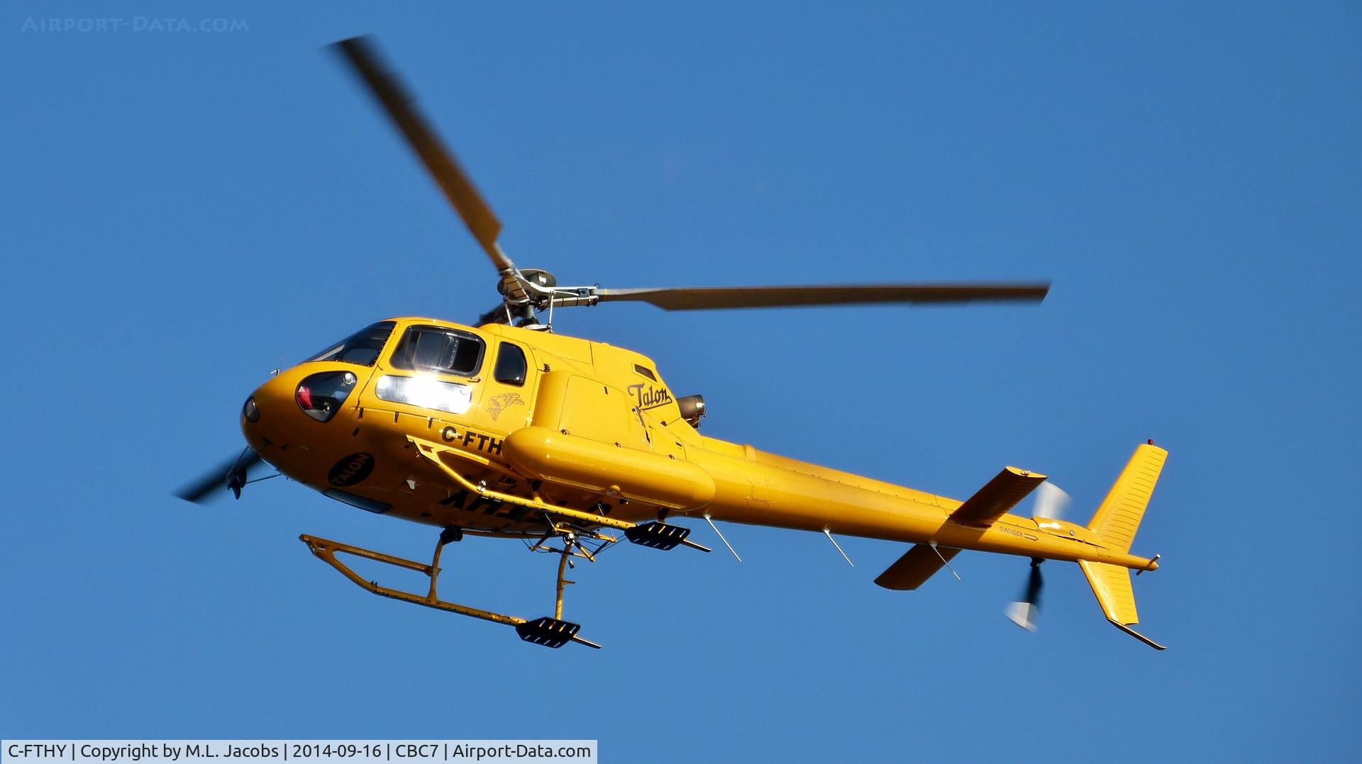 C-FTHY, 1990 Aerospatiale AS-350B Ecureuil C/N 2372, Approaching Vancouver Harbour Heliport.