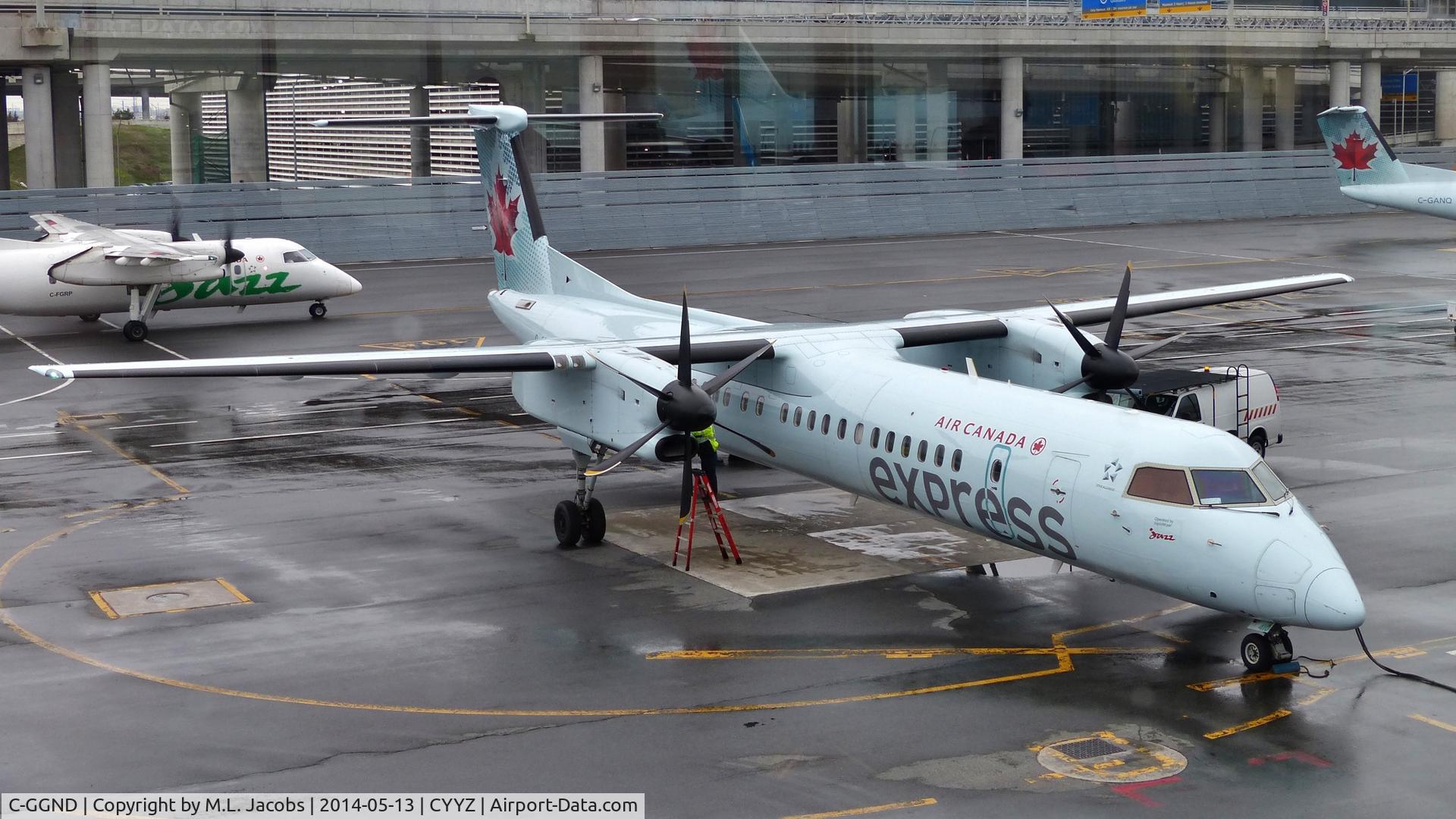 C-GGND, 2011 De Havilland Canada DHC-8-402Q Dash 8 C/N 4394, Air Canada Express Dash 8 on a rainy morning.