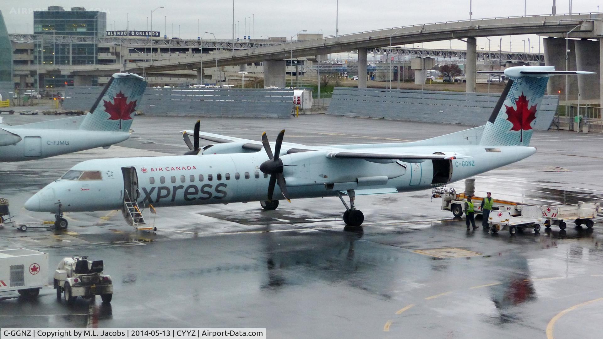 C-GGNZ, 2011 De Havilland Canada DHC-8-402Q Dash 8 C/N 4384, Air Canada Express Dash 8 on a rainy morning.
