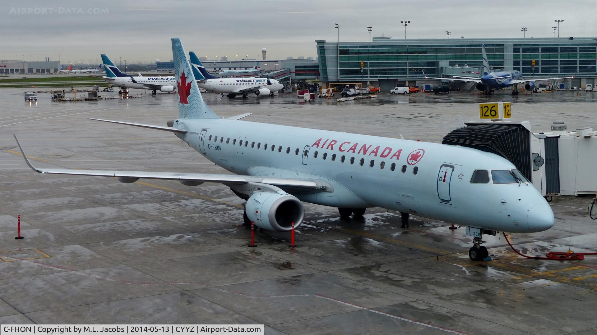 C-FHON, 2007 Embraer 190AR (ERJ-190-100IGW) C/N 19000097, Air Canada Embraer 190 at the gate on a rainy morning.