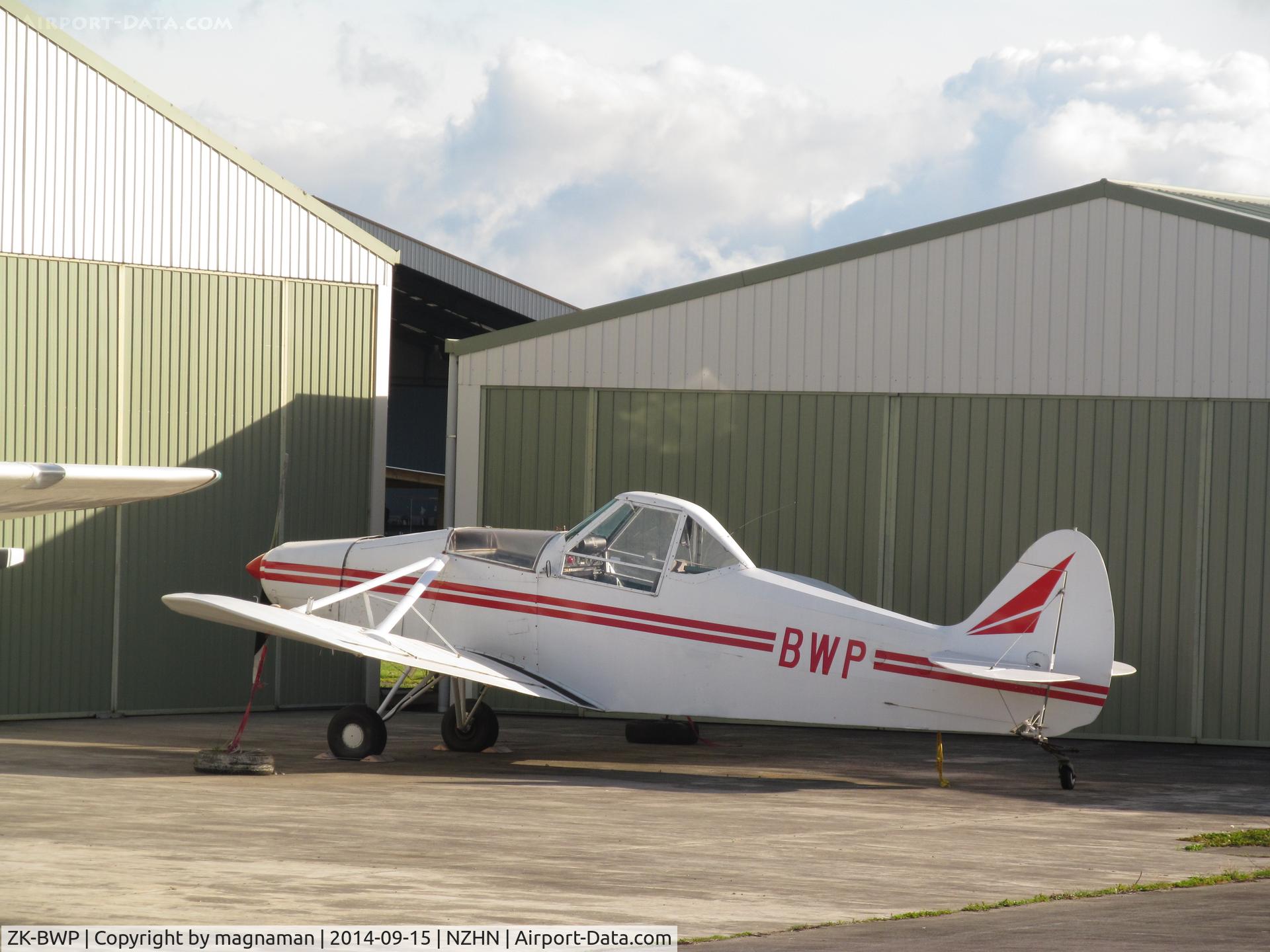 ZK-BWP, Piper PA-25 C/N 25-275, At Hamilton amongst central hangar area