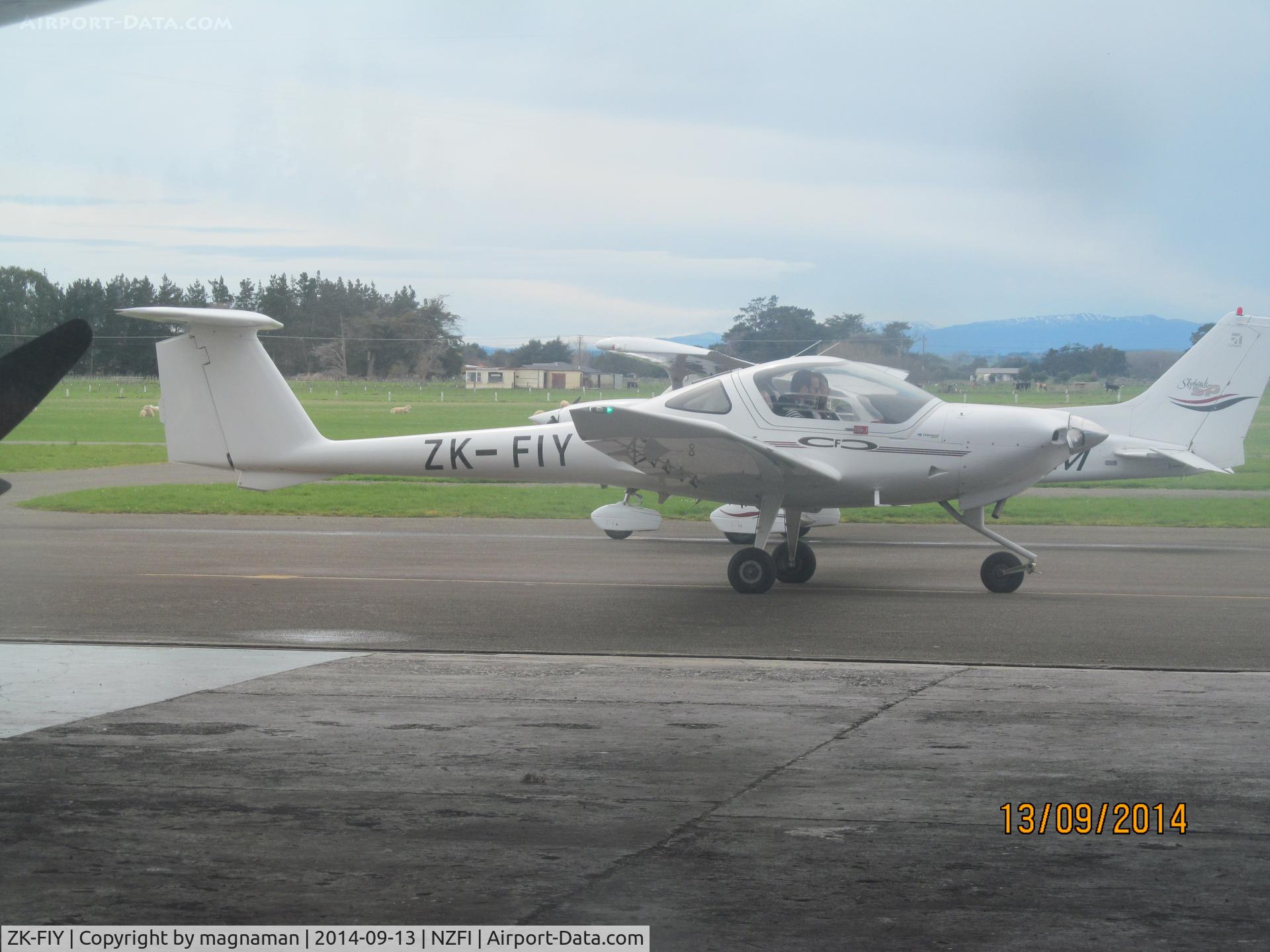 ZK-FIY, Diamond DA-20-C1 Eclipse C/N C0381, shot from rear of hangar through window
