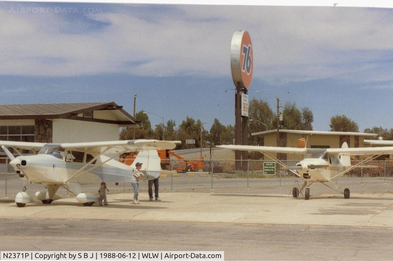 N2371P, 1955 Piper PA-22-150 Tri-Pacer C/N 22-2762, A stop for gas at the Willows airport,Calif. Notice container on top of wing with 99.9 cents a gallon gas. 