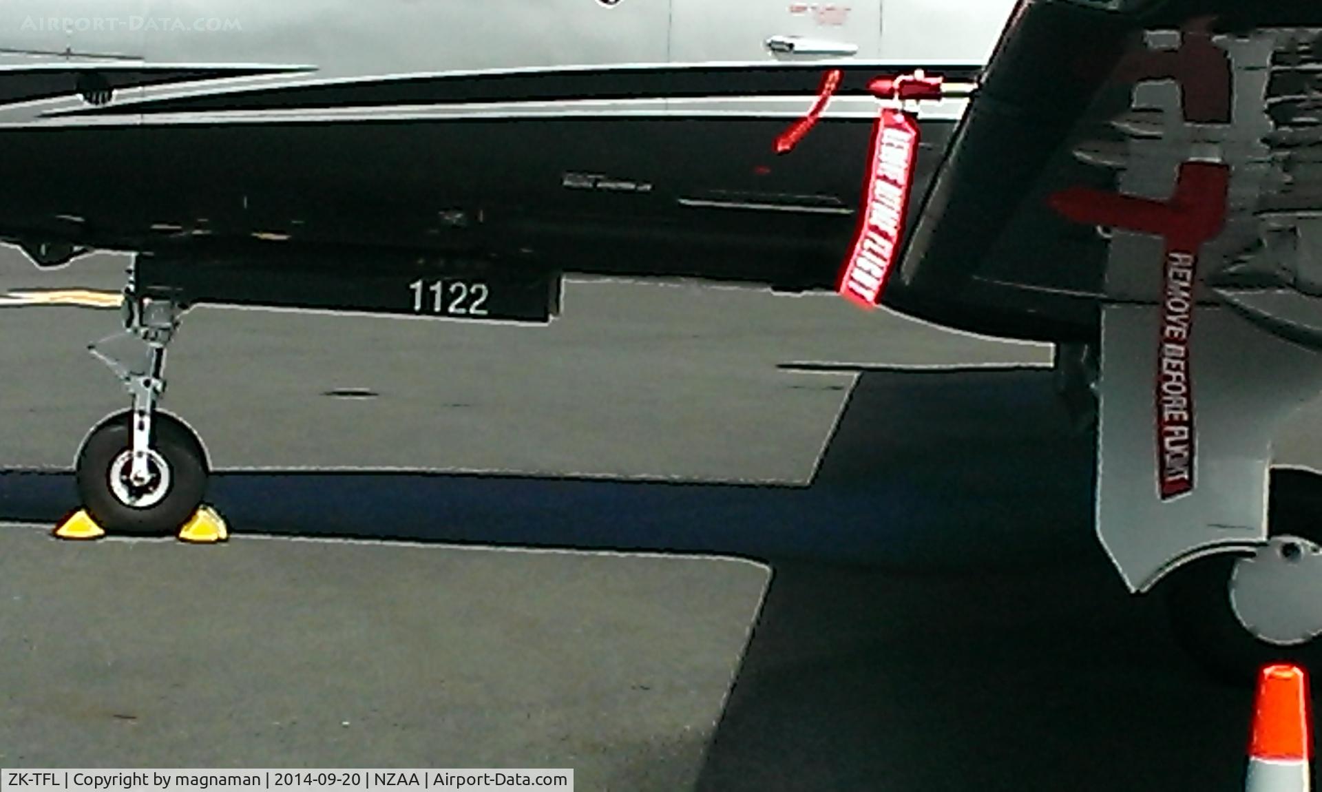 ZK-TFL, 2009 Pilatus PC-12/47E C/N 1122, Just in case you need to know the c/n it is painted on wheel bay
