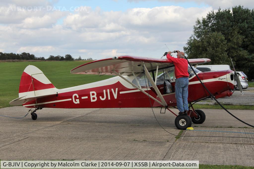 G-BJIV, 1965 Piper PA-18-150 Super Cub C/N 18-8262, Piper PA-18-150 Super Cub at the re-fuelling station. Sutton Bank North Yorkshire, September 7th 2014.