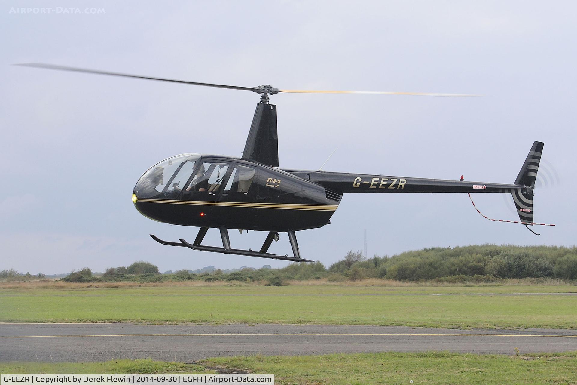 G-EEZR, 2006 Robinson R44 Raven II C/N 11391, Visiting Raven II, Thruxton based, seen lifting at EGFH after picking up a passenger, en-route to Preston.