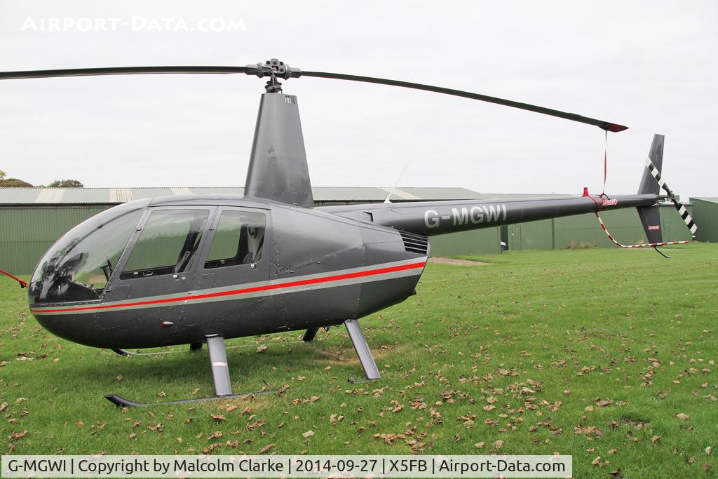 G-MGWI, 2000 Robinson R44 Astro C/N 0663, Robinson R44 Astro, Fishburn Airfield UK, September 27th 2014.