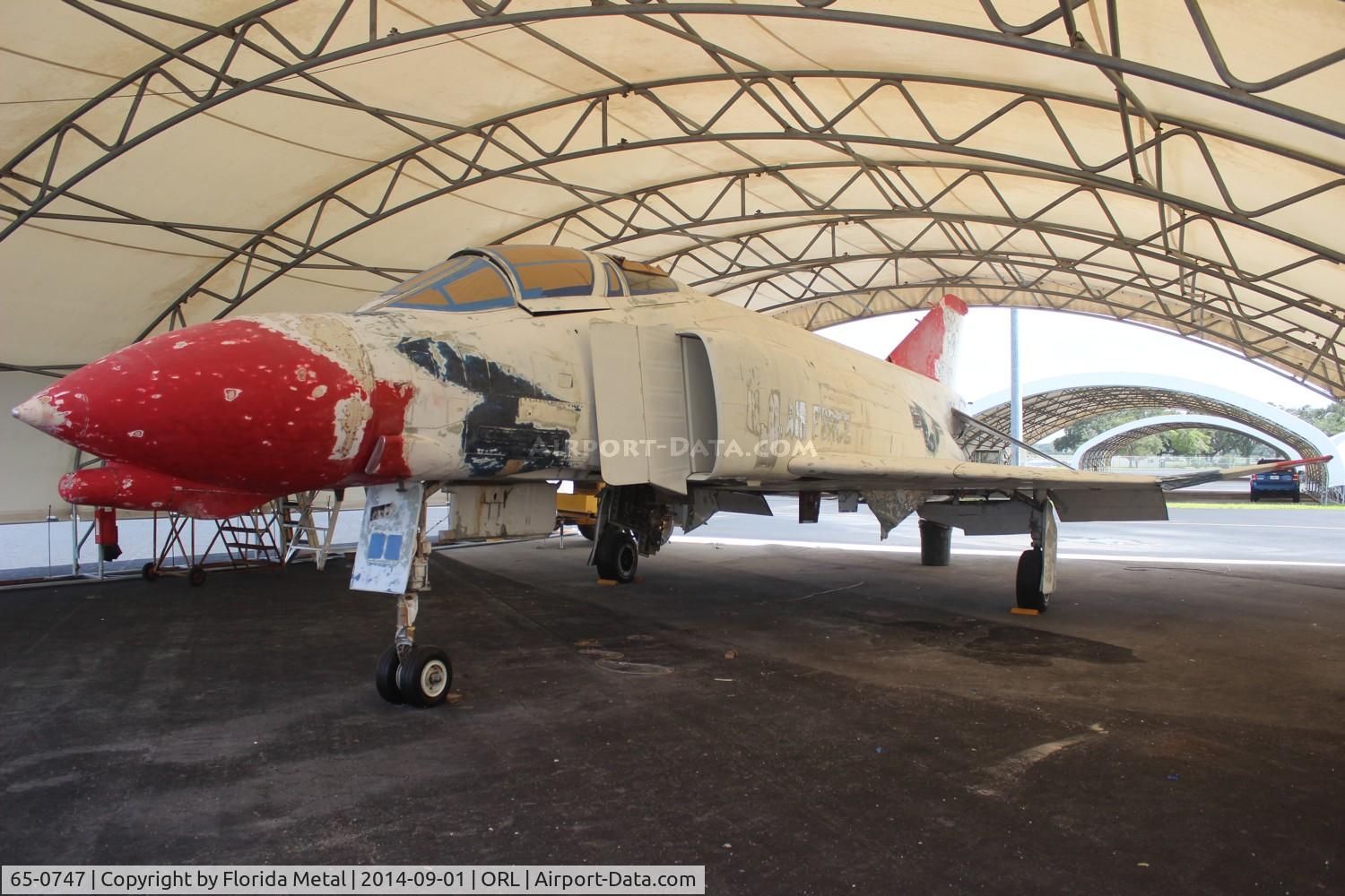 65-0747, 1965 McDonnell F-4D Phantom II C/N 1810, F-4D Phantom II in Orlando in Thunderbird markings being prepared for Vietnam era markings before it gets put on display at the Nearby Kittinger Park