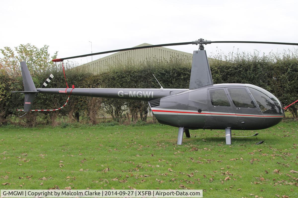 G-MGWI, 2000 Robinson R44 Astro C/N 0663, Robinson R44 Astro, Fishburn Airfield UK, September 27th 2014.