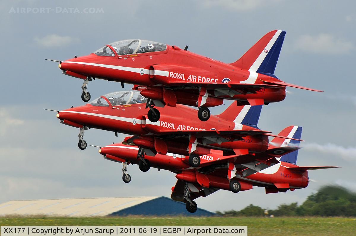 XX177, 1977 Hawker Siddeley Hawk T.1 C/N 024/312024, Trademark tight formation take-off by the Red Arrows at the Cotswold Airshow 2011. Behind XX177 are XX237 and XX227.