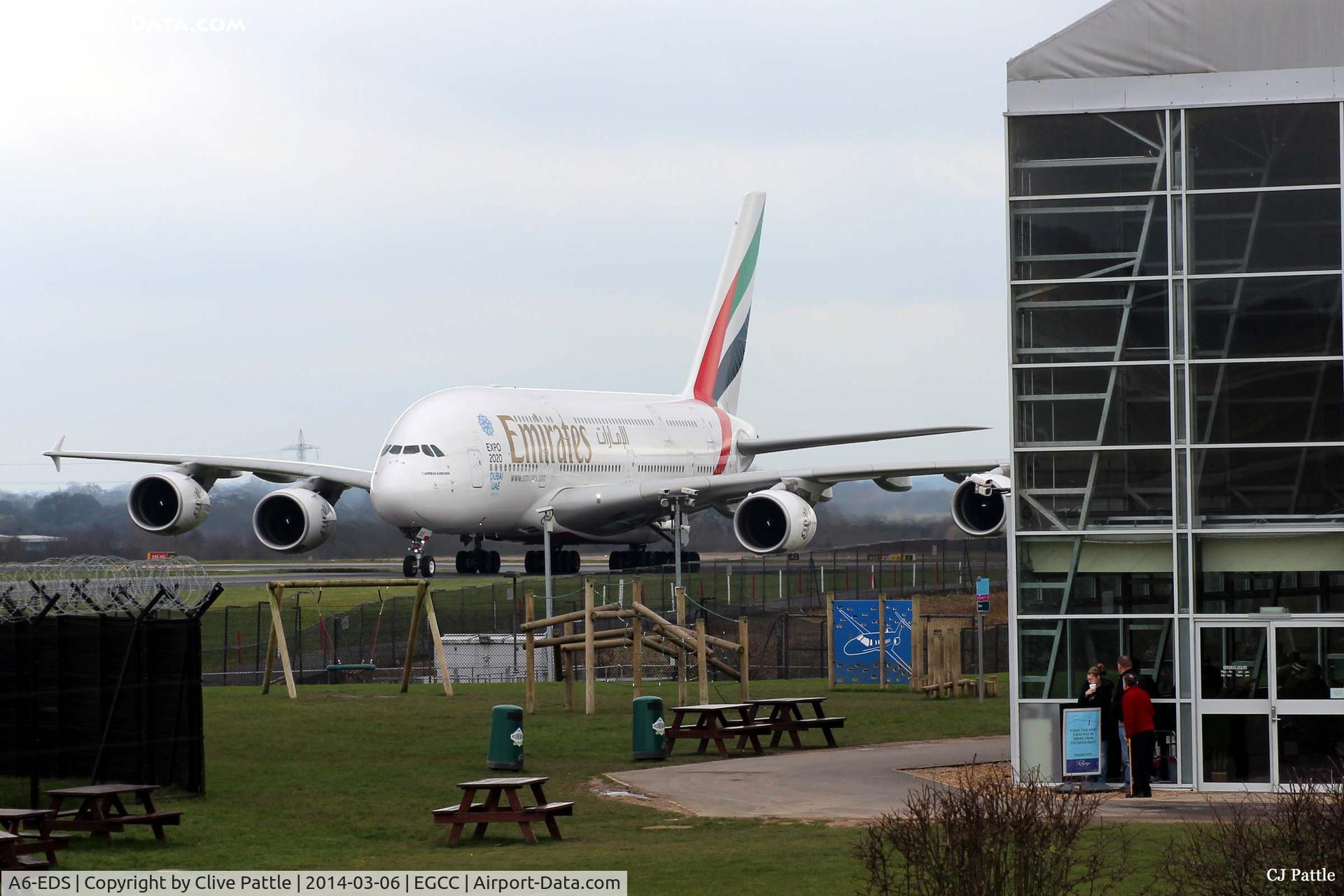 A6-EDS, 2011 Airbus A380-861 C/N 086, Manchester arrival - taxy to the gate past the Restaurant and Concorde Hangar