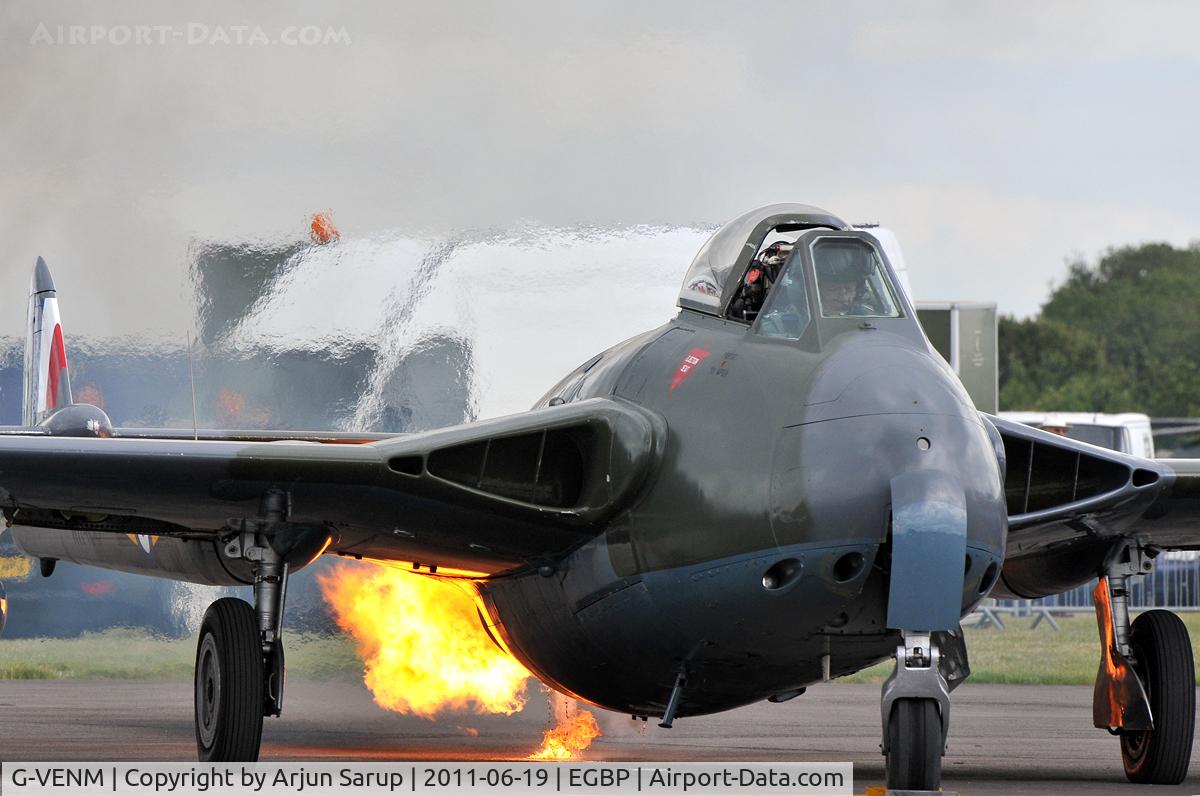 G-VENM, 1955 De Havilland DH-112 Venom FB.50 C/N 824, Impressive engine start of the Venom, with ignited fuel dripping on to the tarmac at the Cotswold Airshow 2011.