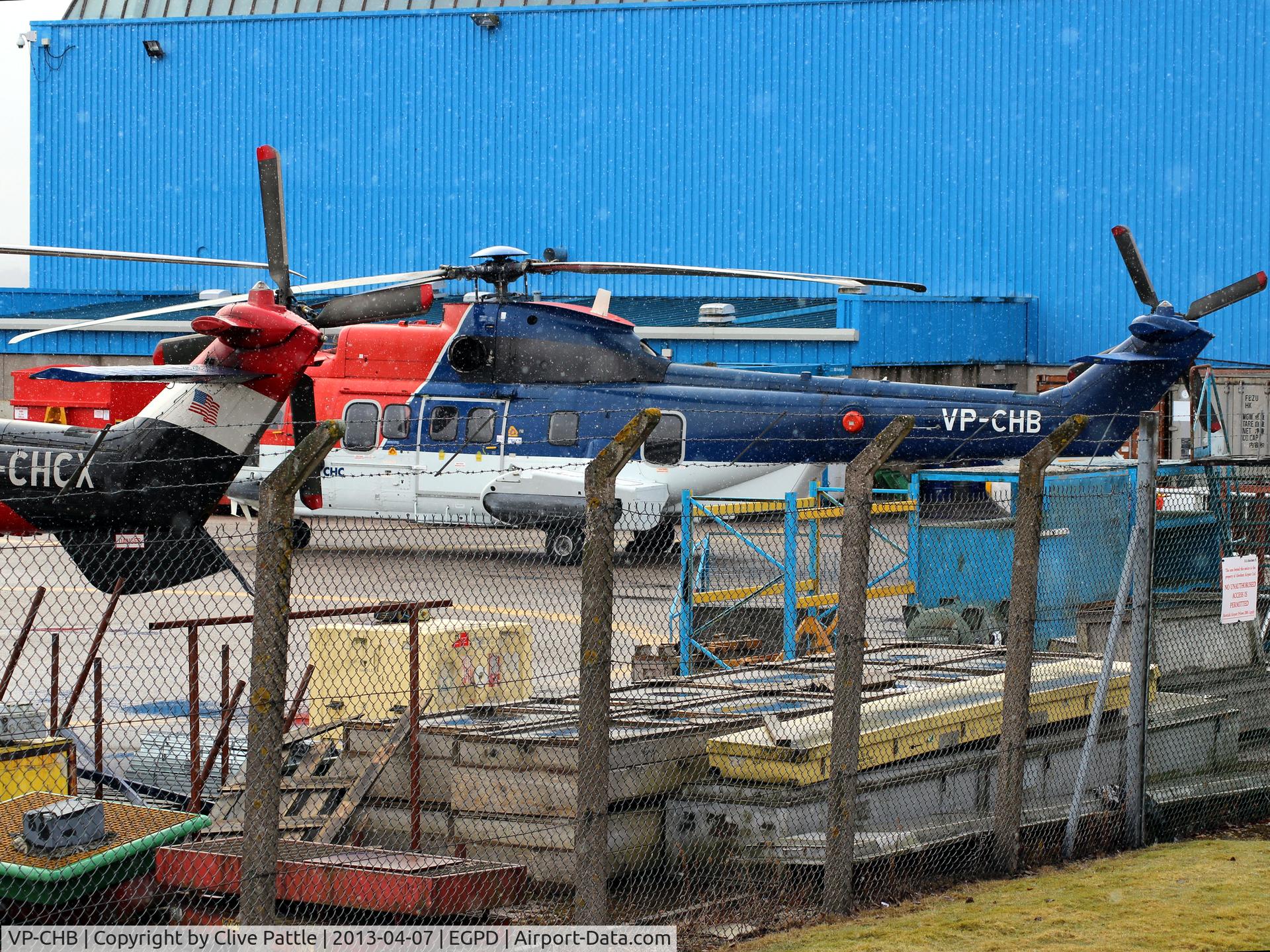 VP-CHB, 2002 Eurocopter AS-332L2 Super Puma Mk2 C/N 2582, Ex CHC Helicopters Cayman - seen parked up at a snowy Aberdeen awaiting registration change to G-WNSB with CHC Scotia. This a/c ditched on 23-08-13 off Sumburgh with the loss of 4 lives