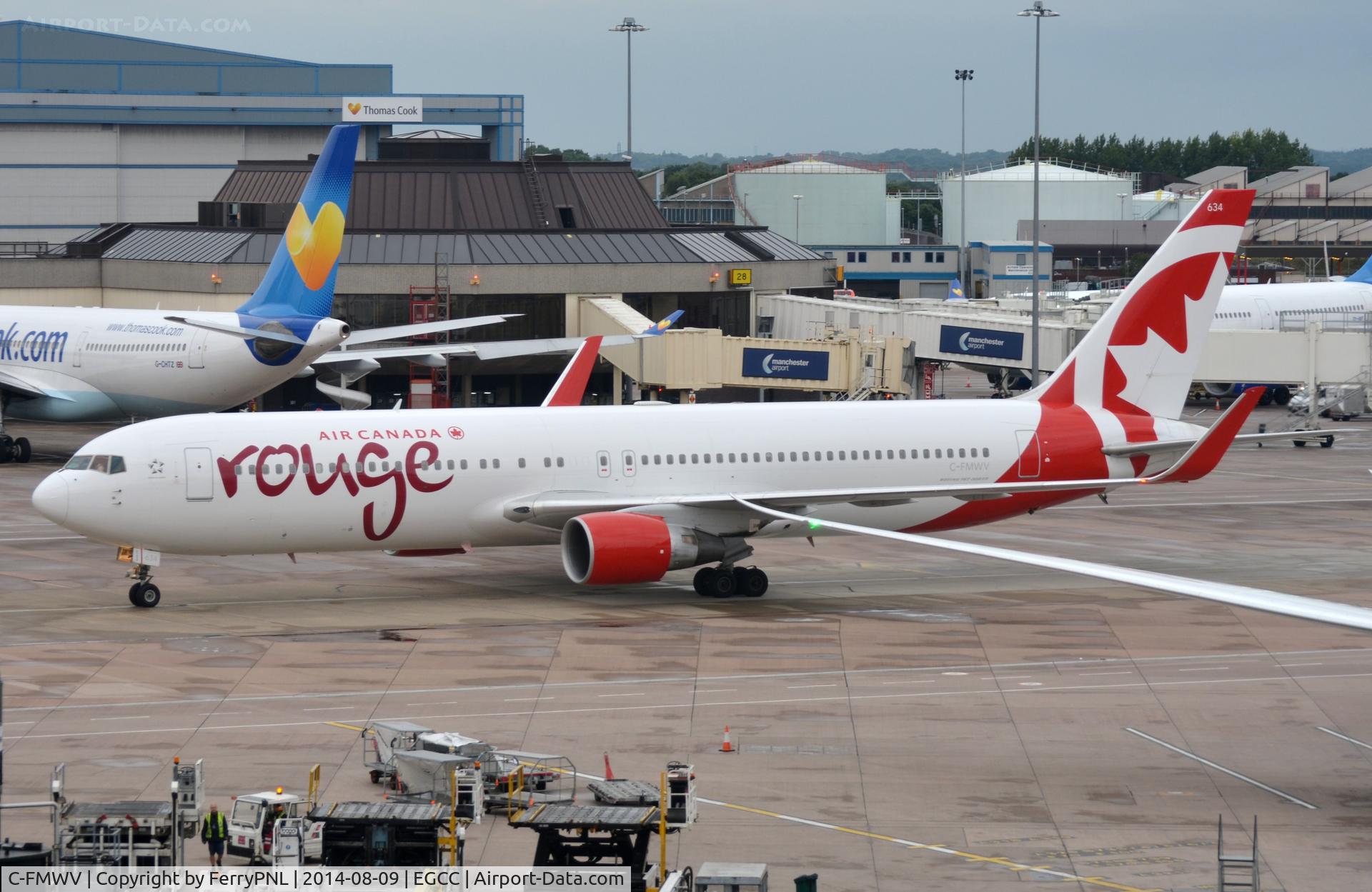 C-FMWV, 1995 Boeing 767-333/ER C/N 25586, AC Rouge arriving at its gate.
