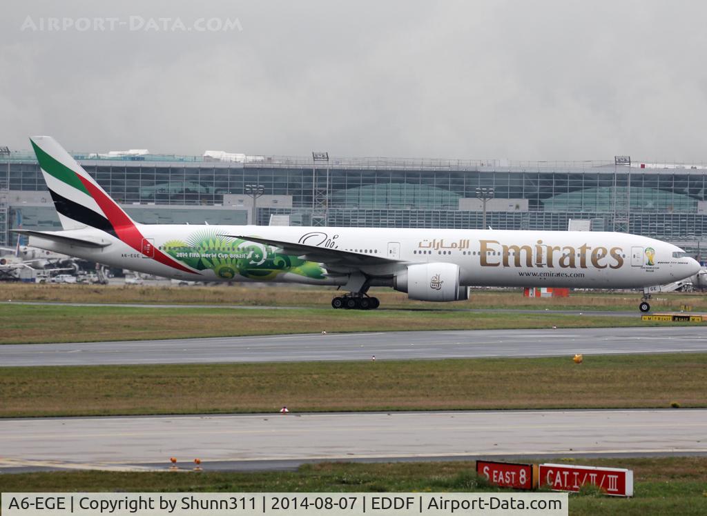 A6-EGE, 2011 Boeing 777-31H/ER C/N 35597, Taxiing to his gate with additional Wold Cup Brasil logo on rear fuselage and small logo on nose...