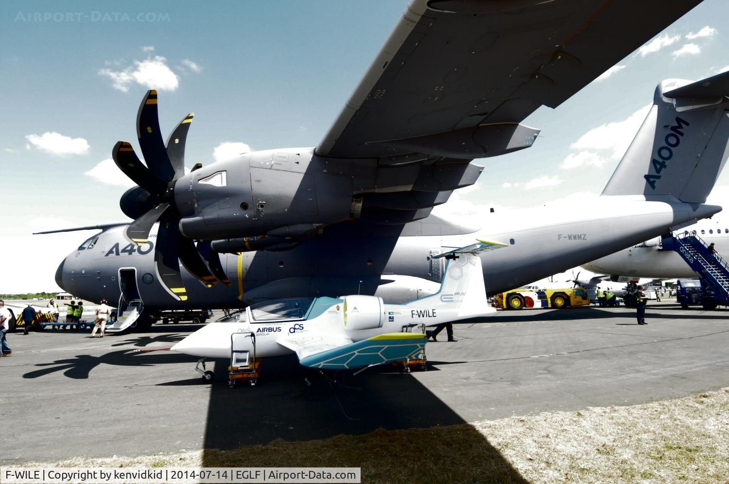 F-WILE, 2014 Airbus E-Fan C/N 001, Nestling under the wing of the A400M.