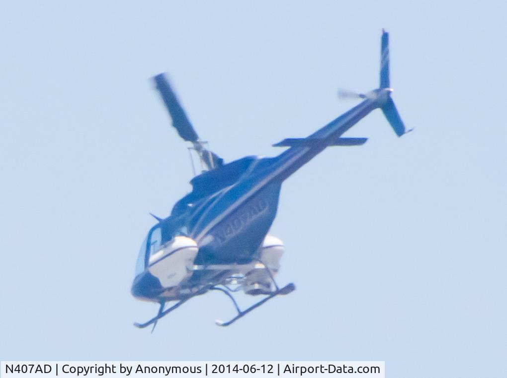 N407AD, Bell 206B C/N 4023, Seen in flight over Carmel Valley area of San Diego, CA near the interchange of the 5 and 56 freeways