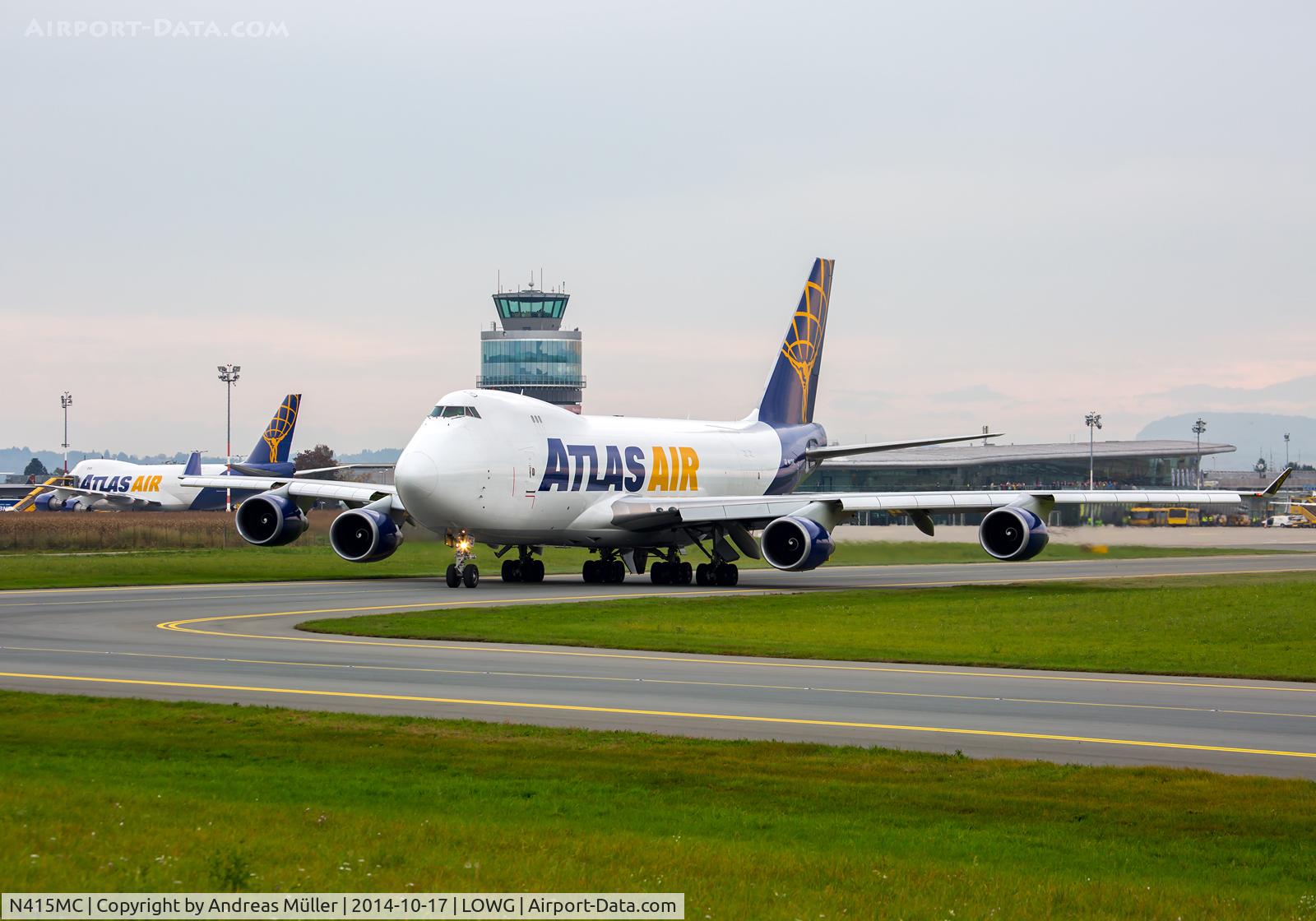 N415MC, 2002 Boeing 747-47UF C/N 32837, Two Boeing 747 @ LOWG.
