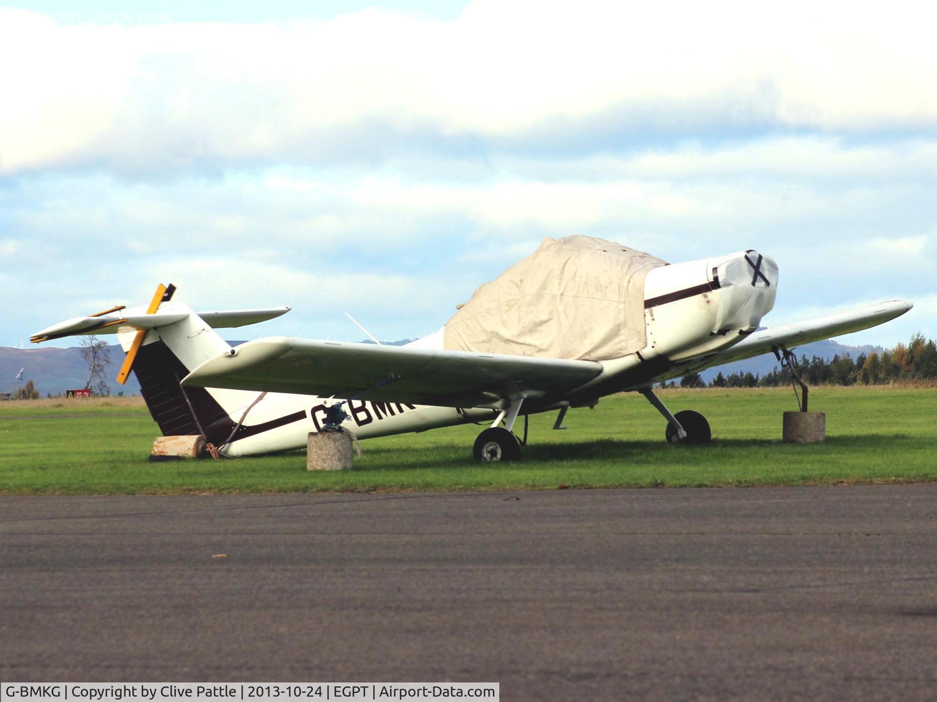 G-BMKG, 1982 Piper PA-38-112 Tomahawk Tomahawk C/N 38-82A0050, Wearing its body warmer on the apron at Perth EGPT