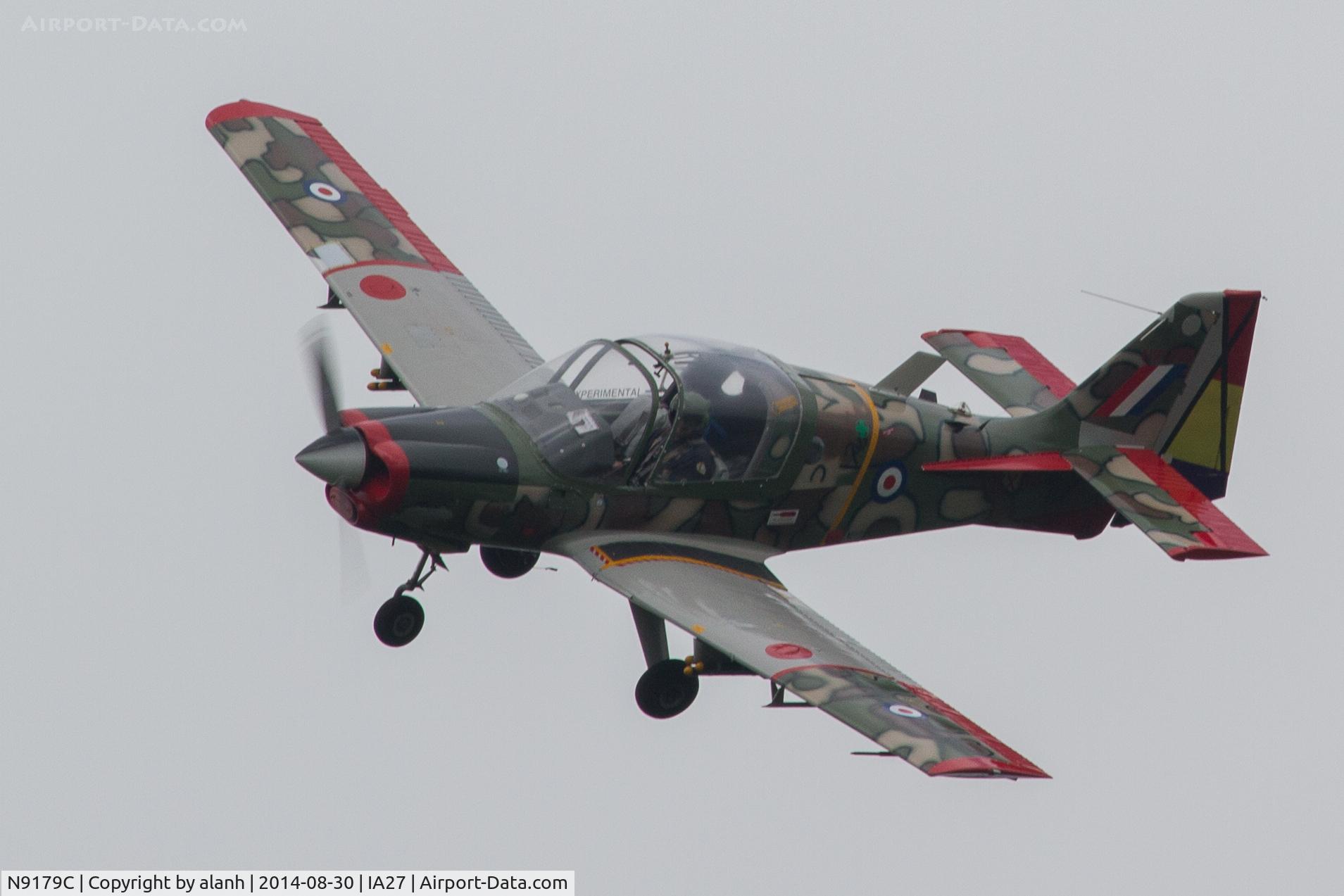 N9179C, 1973 Scottish Aviation Bulldog T.1 C/N BH120/233, Overhead Antique Airfield, unable to land with the runway waterlogged and closed. Image is a bit small and soft but it shows the topside colour scheme.