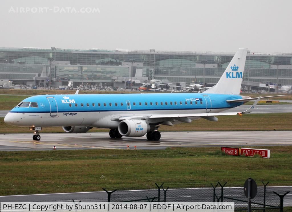 PH-EZG, 2009 Embraer 190LR (ERJ-190-100LR) C/N 19000315, Taxiing holding point rwy 18 for departure...