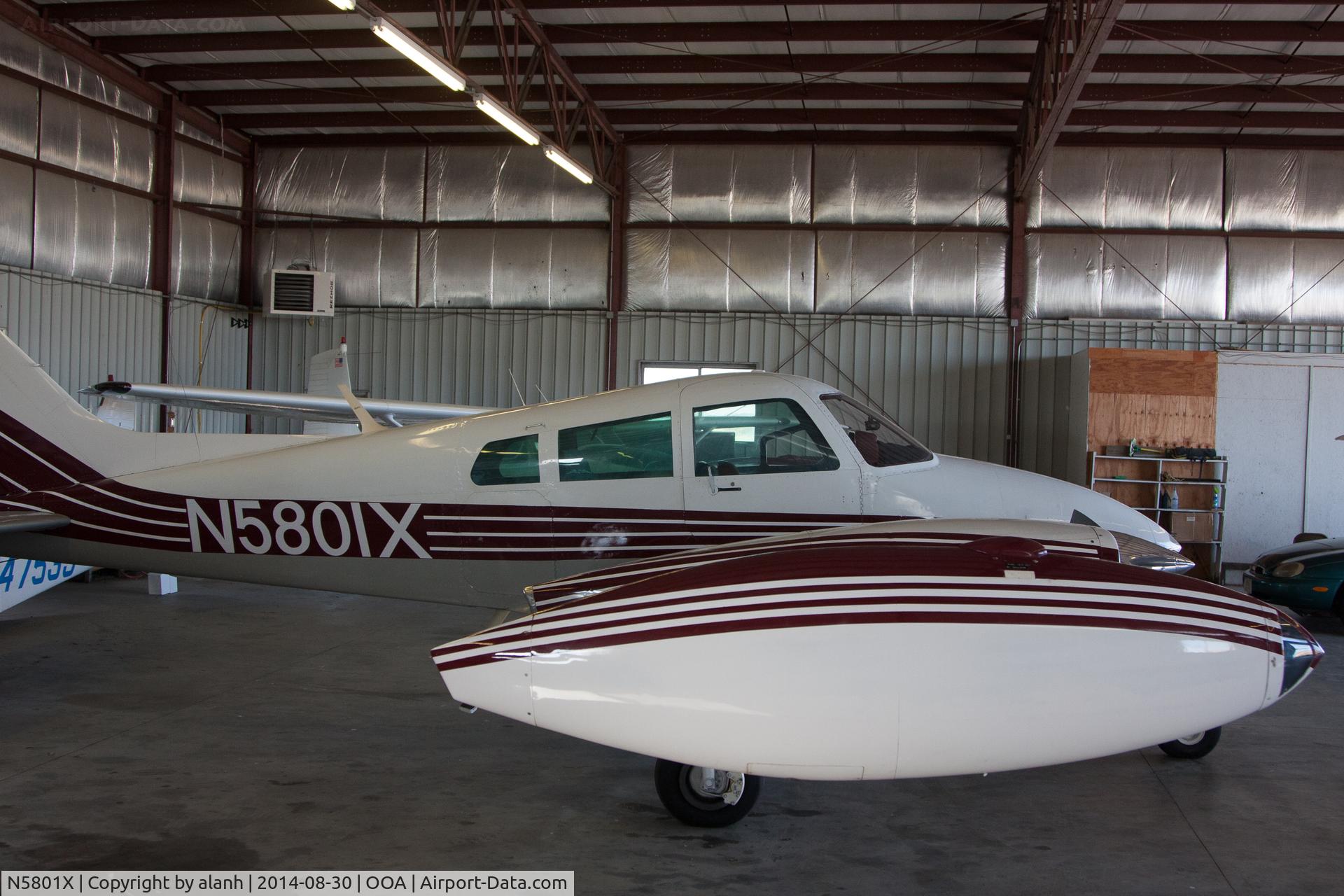 N5801X, 1961 Cessna 310F C/N 310-0101, Inside at Oskaloosa. Must try harder but at least it gives a general idea of the paint scheme.