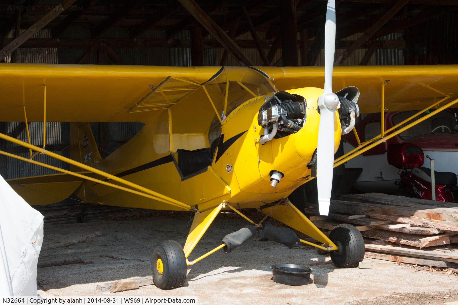 N32664, 1940 Piper J3L-65 Cub C/N 5523, Under cover at Log Cabin airport