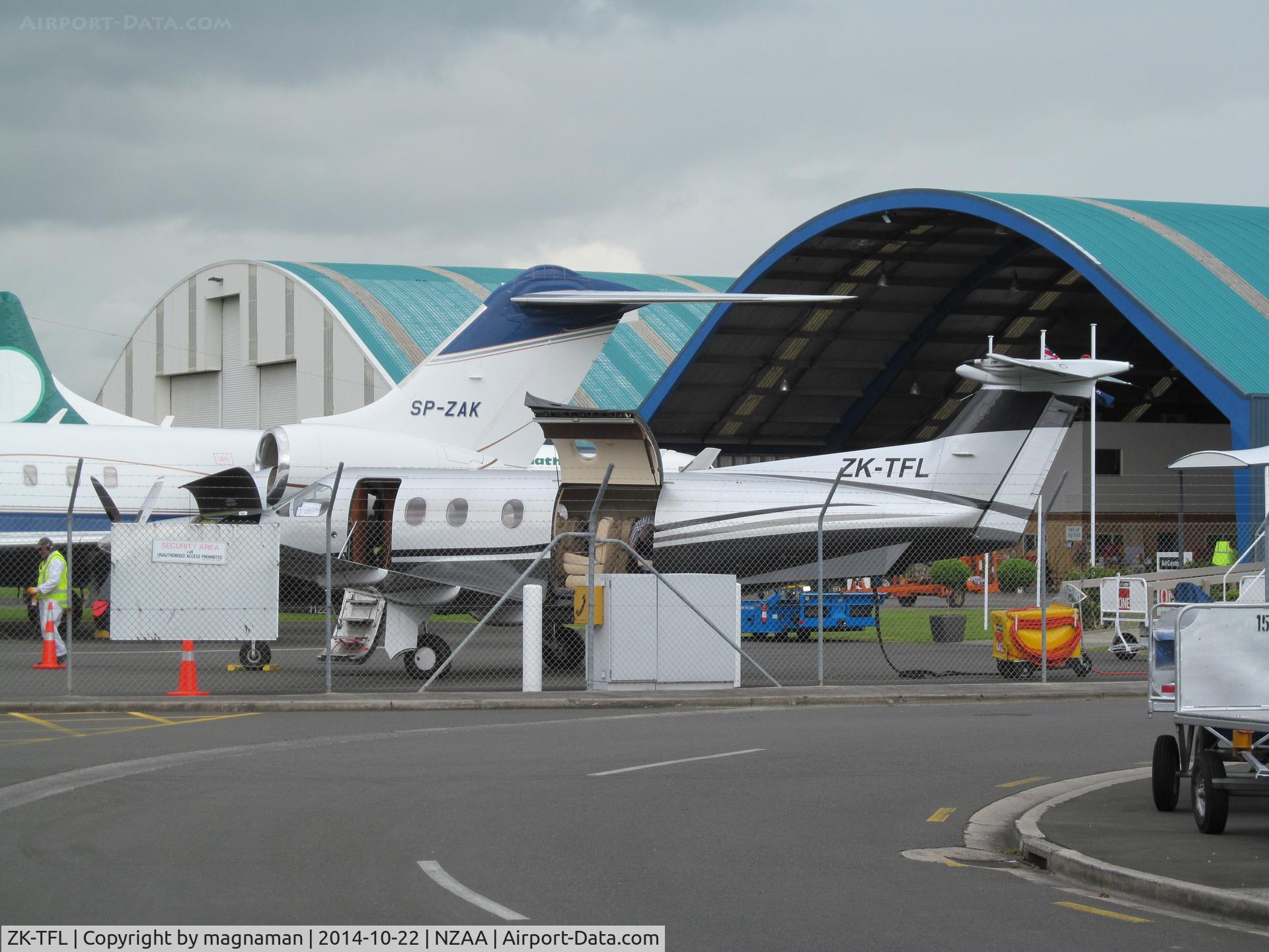 ZK-TFL, 2009 Pilatus PC-12/47E C/N 1122, with exotic polish biz behind on crowded convair ramp at AKL.