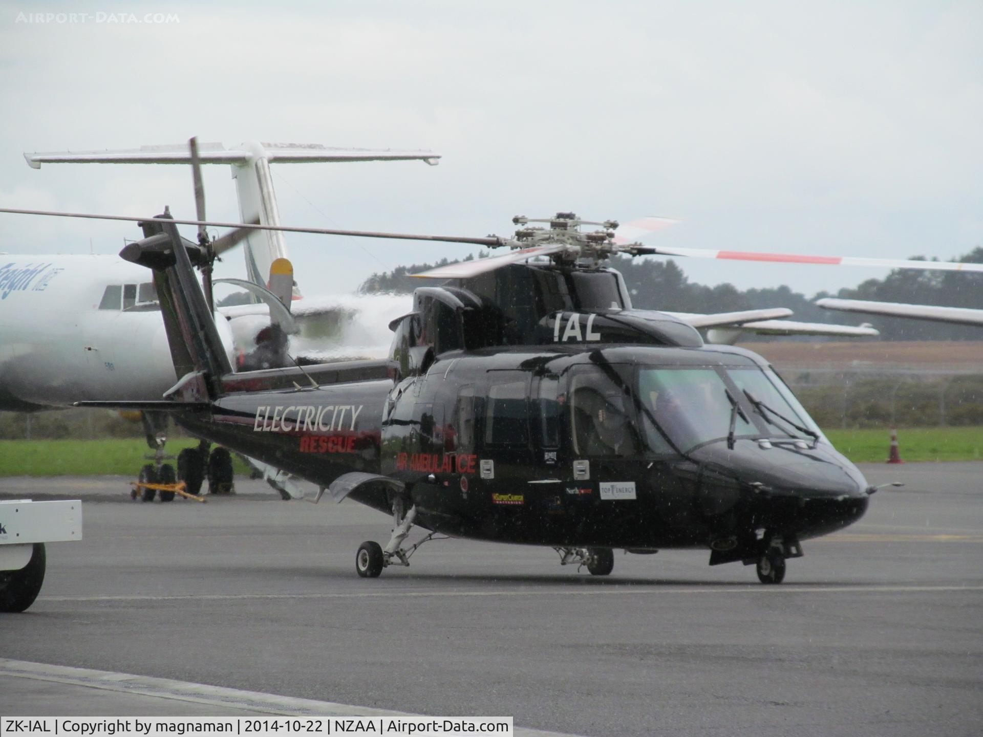 ZK-IAL, 1999 Sikorsky S-76A C/N 760133, Medic chopper dropping of someone at AKL. Outside hangar where ZK-NSS is based.