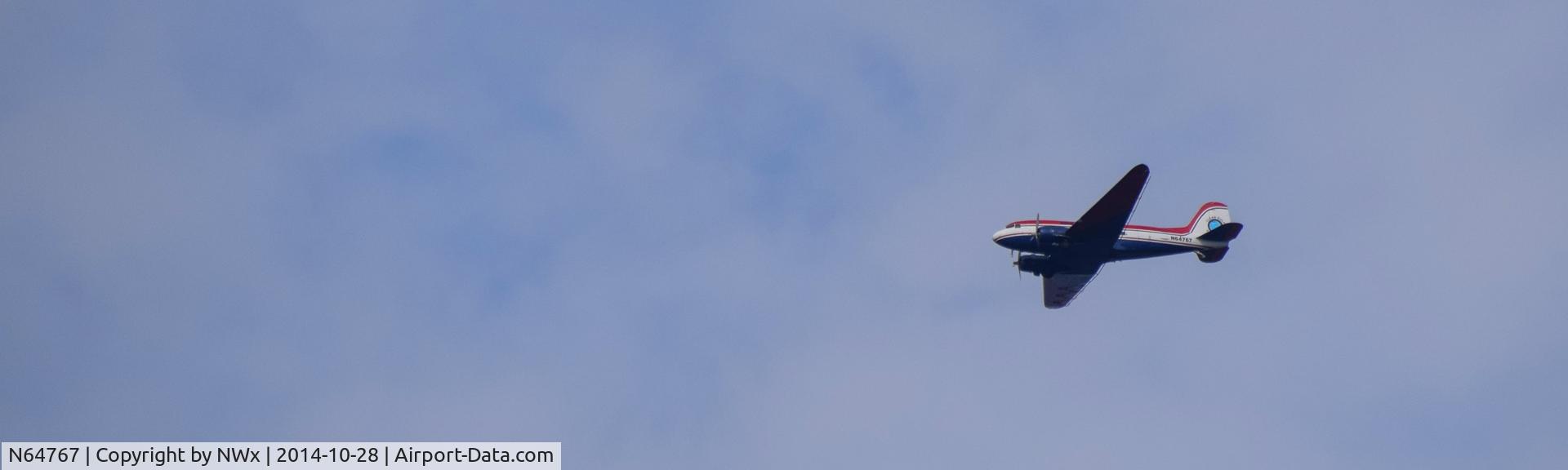 N64767, 1944 Douglas C-47A Skytrain C/N 13303, Shot this 10-28-14 as it flew west bound over Fairhope, Al. toward Mobile, Al.