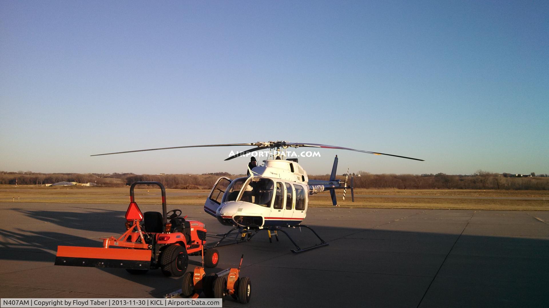 N407AM, 1998 Bell 407 C/N 53309, Checking the girl out before flight