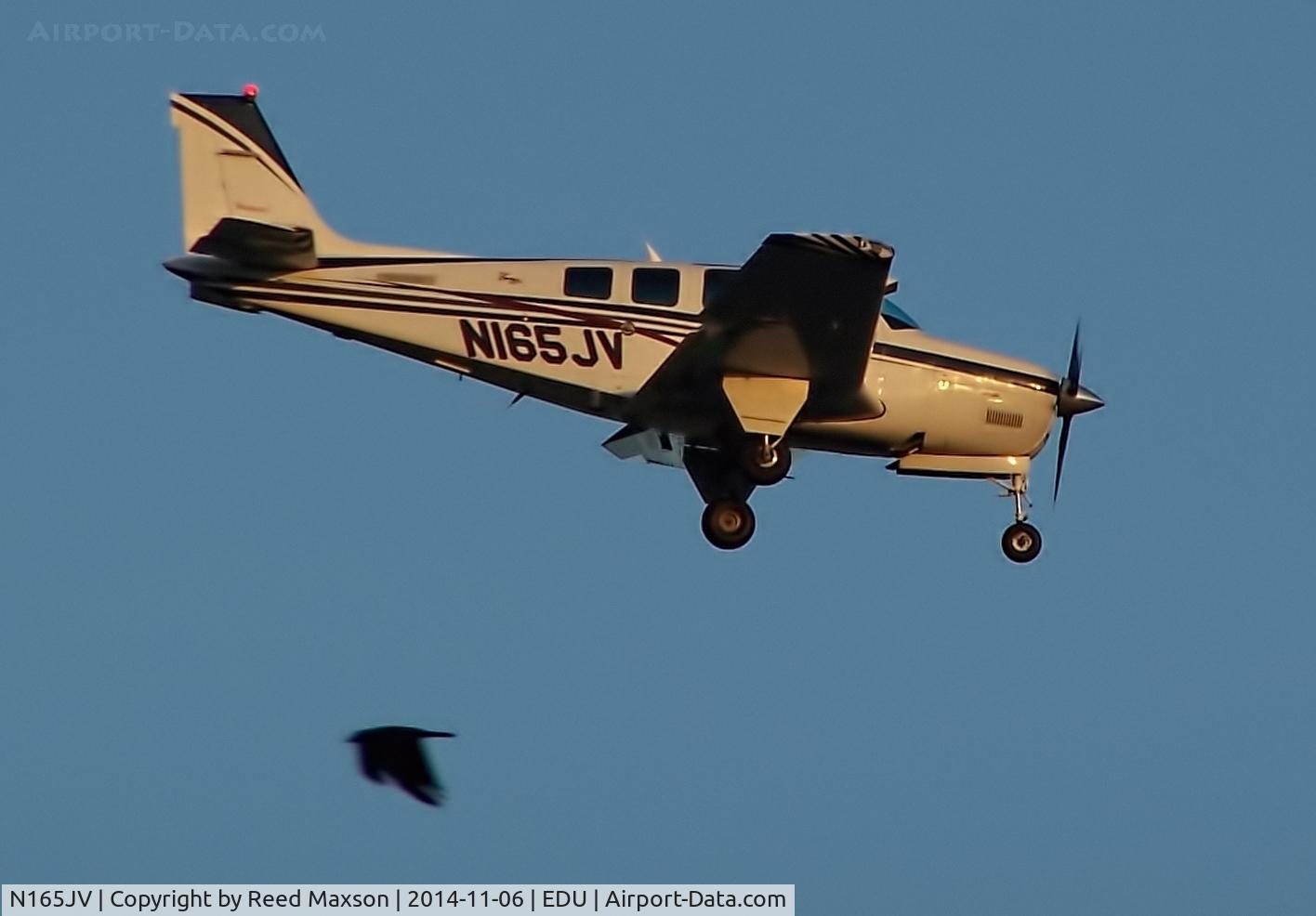 N165JV, 1998 Raytheon Aircraft Company A36 Bonanza C/N E-3180, On final at EDU, crow on downwind.