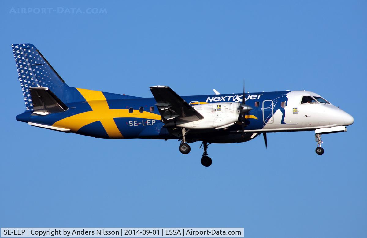 SE-LEP, 1988 SAAB SF340A C/N 340A-127, On short final for runway 01R. NextJet sponsored the Swedish cross-country team