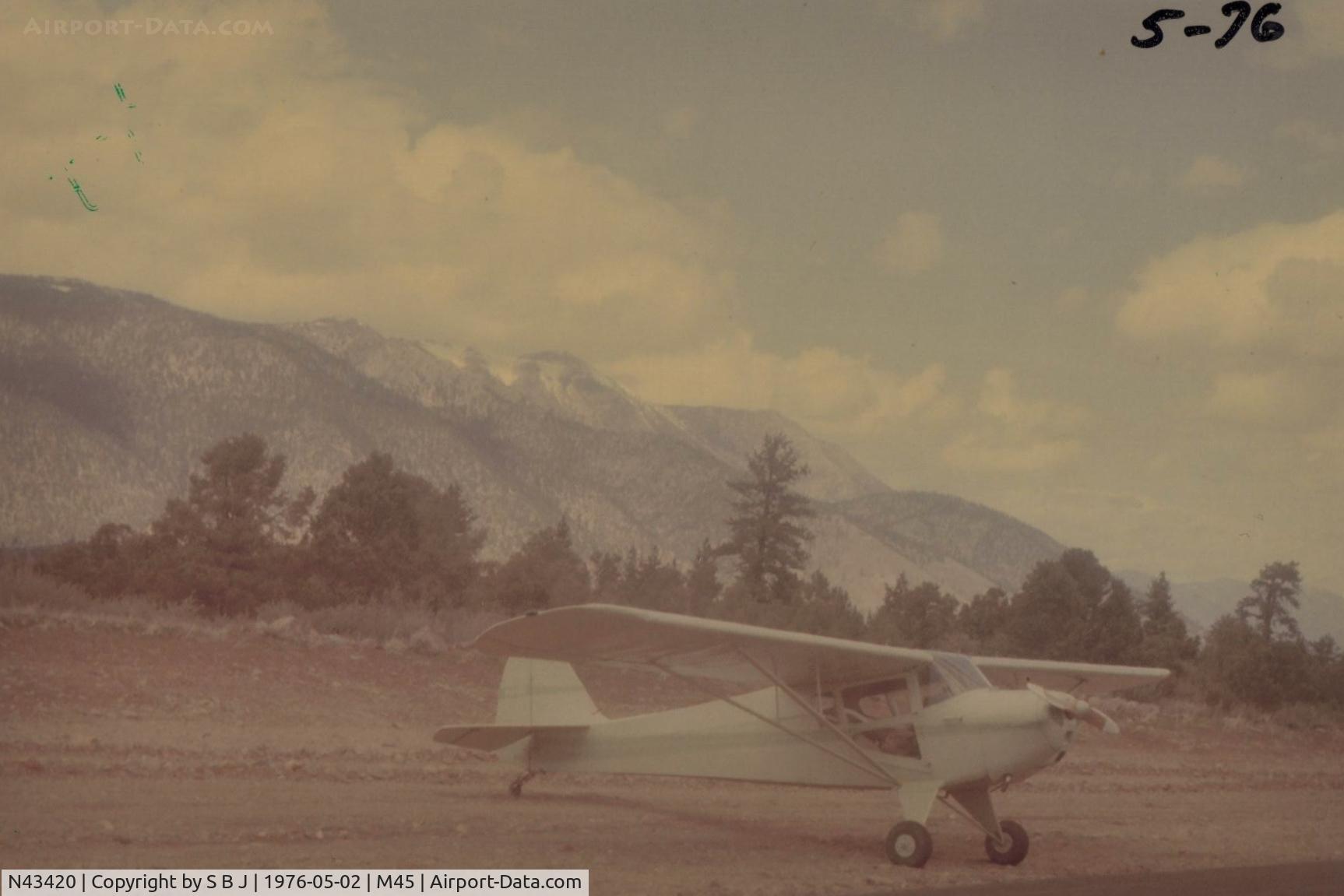 N43420, 1946 Taylorcraft BC12-D C/N 7079, N43420 at Alpine Co.with view to NW and some tall mountains that it just flew over.Tcrafts perform good at these 6K feet airports on only 65hp.They are  excellent at using Mother Natures (updraft) lift. Often seen 2K feet up on the VSI.Exciting ride.