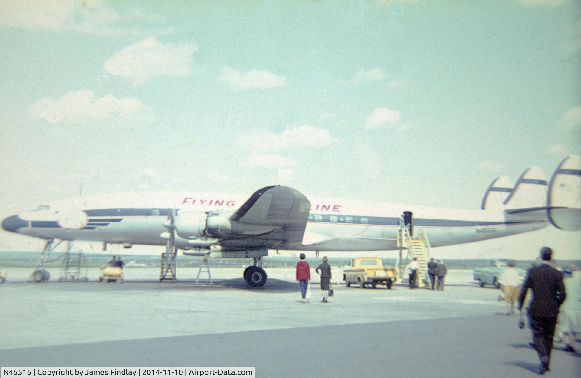 N45515, 1958 Lockheed L-1049H-82 Super Constellation C/N 4843, N5515 on the tarmac at Gander, Newfoundland refueling on a charter flight from Prestwick, Scotland to New York in 1964,  Flying Tiger Lines operated this aircraft as a cargo plane but it could be fitted with metal frame canvas seats for charter flights.