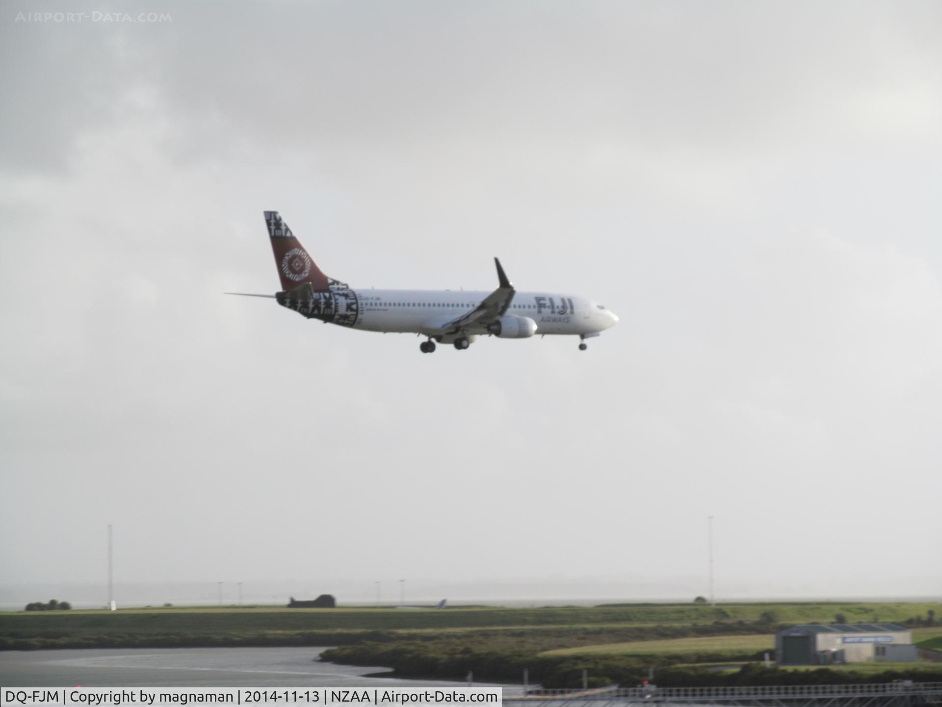 DQ-FJM, 2010 Boeing 737-86J C/N 37754, On short finals on very windy day hence slight fuzzy photo