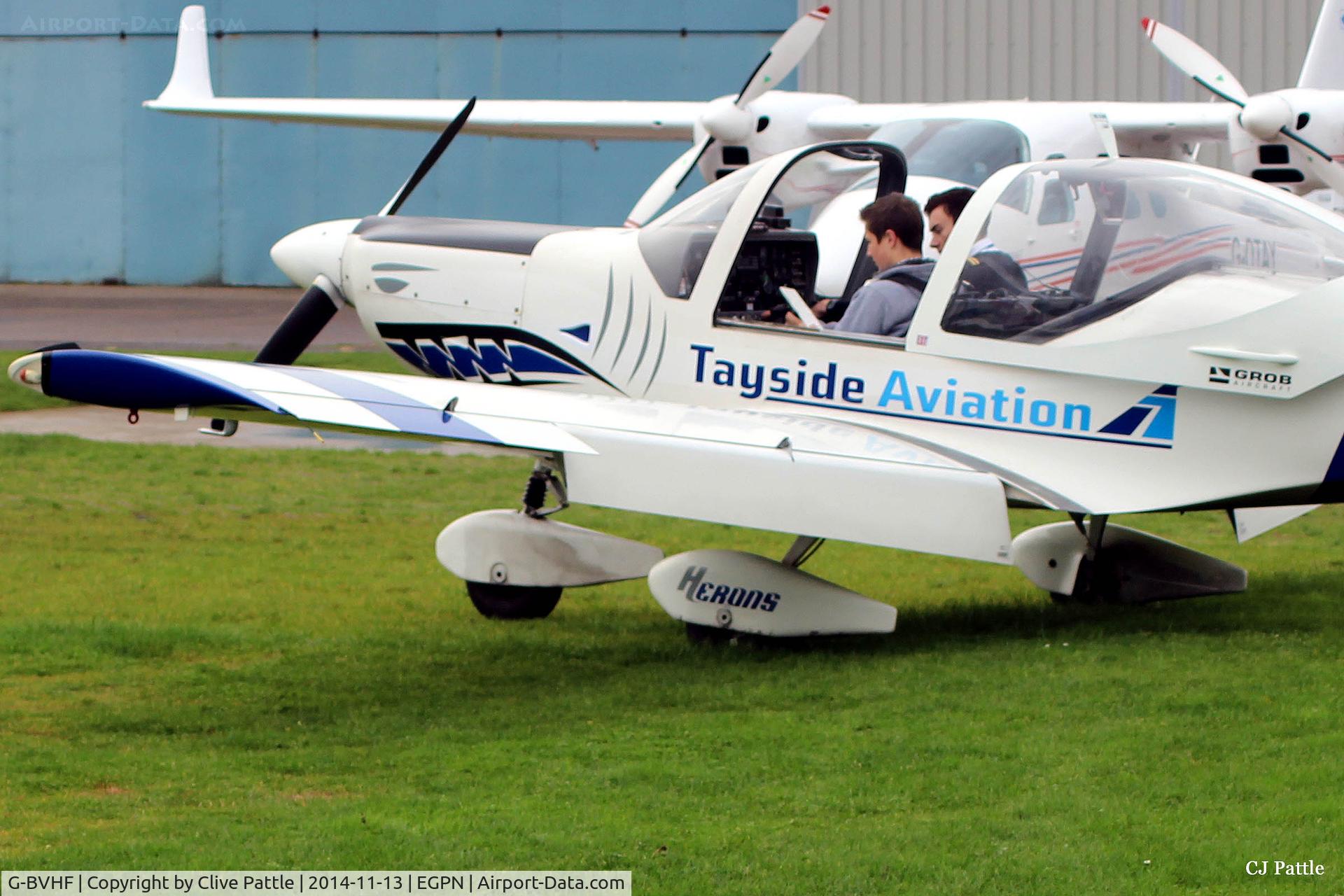 G-BVHF, 1994 Grob G-115D-2 C/N 82011, On duty at Dundee Riverside EGPN - student pre-flight checks with the instructor - became G-ROBA in March 2016
