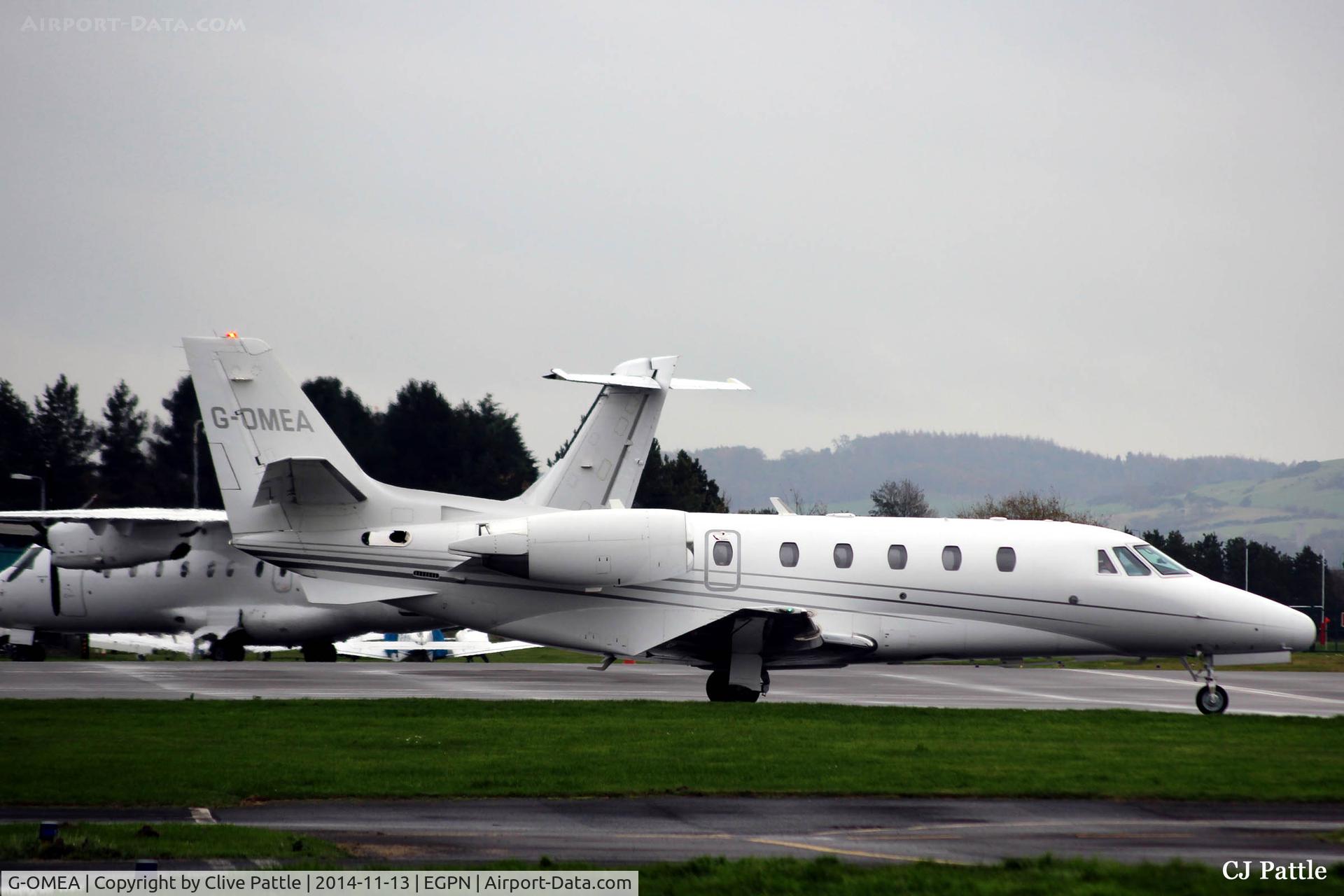 G-OMEA, 2006 Cessna 560XL Citation XLS C/N 560-5610, On the ramp at Dundee Riverside airport EGPN on a wet November day.