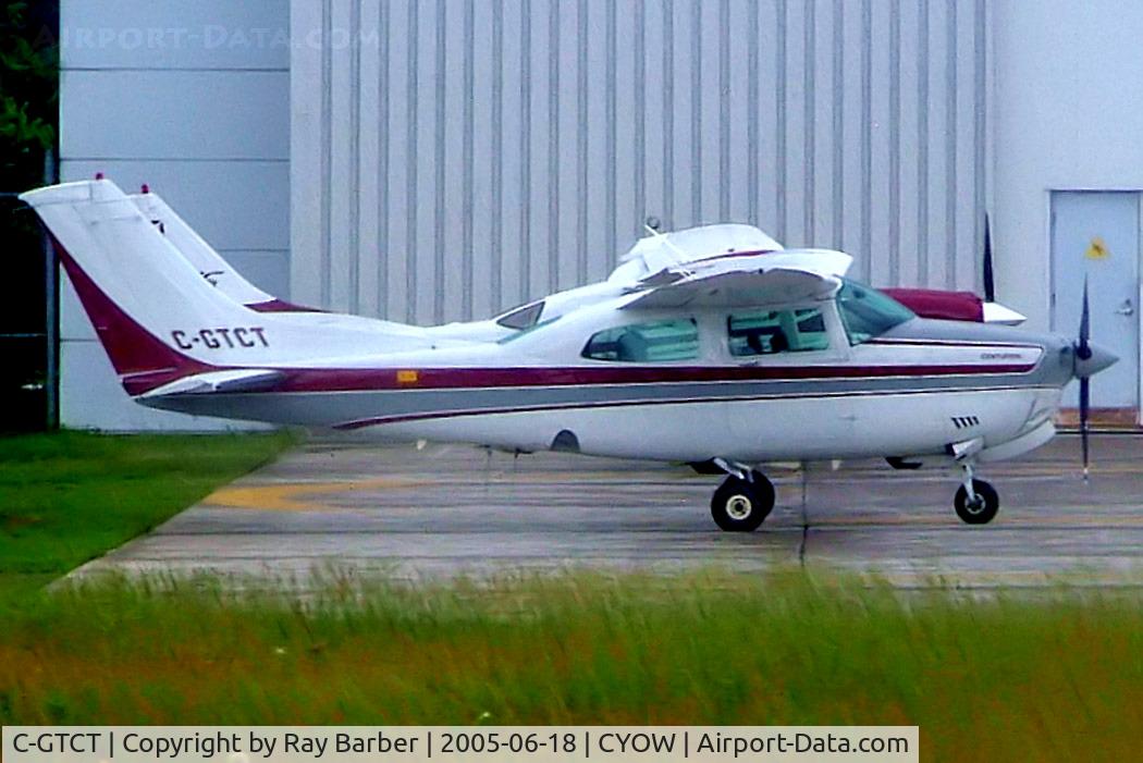 C-GTCT, 1985 Cessna 210R Centurion C/N 21064949, Cessna T.210R Turbo Centurion [210-64949] Ottawa-Macdonald Cartier International~C 18/06/2005. Taken through glass on coach whilst moving.