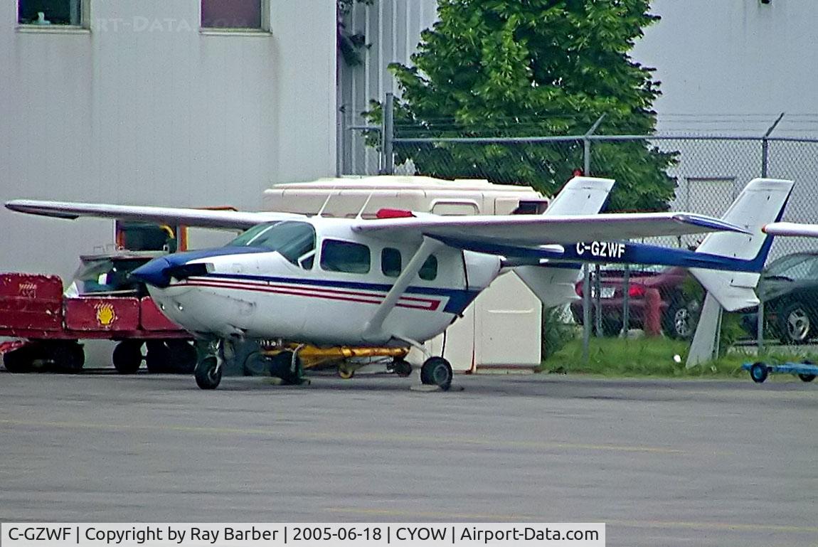 C-GZWF, 1978 Cessna 337H Super Skymaster C/N 33701862, Cessna 337H Super Skymaster [337-01862] Ottawa-Macdonald Cartier International~C 18/06/2005. Taken through glass on coach whilst moving.