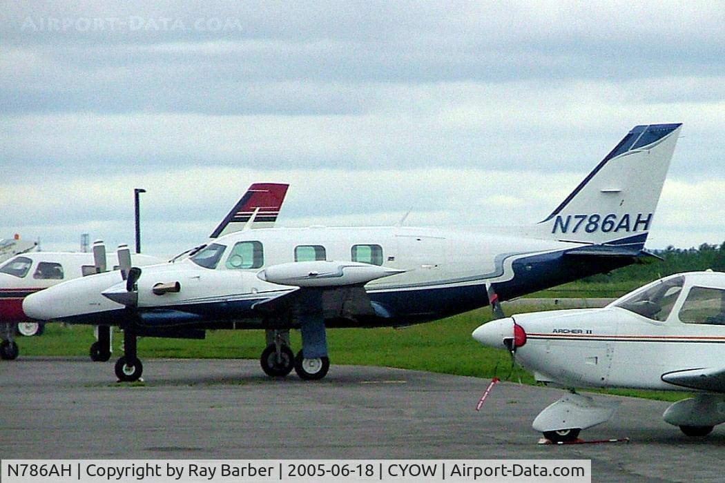 N786AH, 1978 Piper PA-31T C/N 31T-7820053, Piper PA-31T Cheyenne II [31T-7820053] Ottawa-Macdonald Cartier International~C 18/06/2005.  Taken through glass on coach whilst moving.