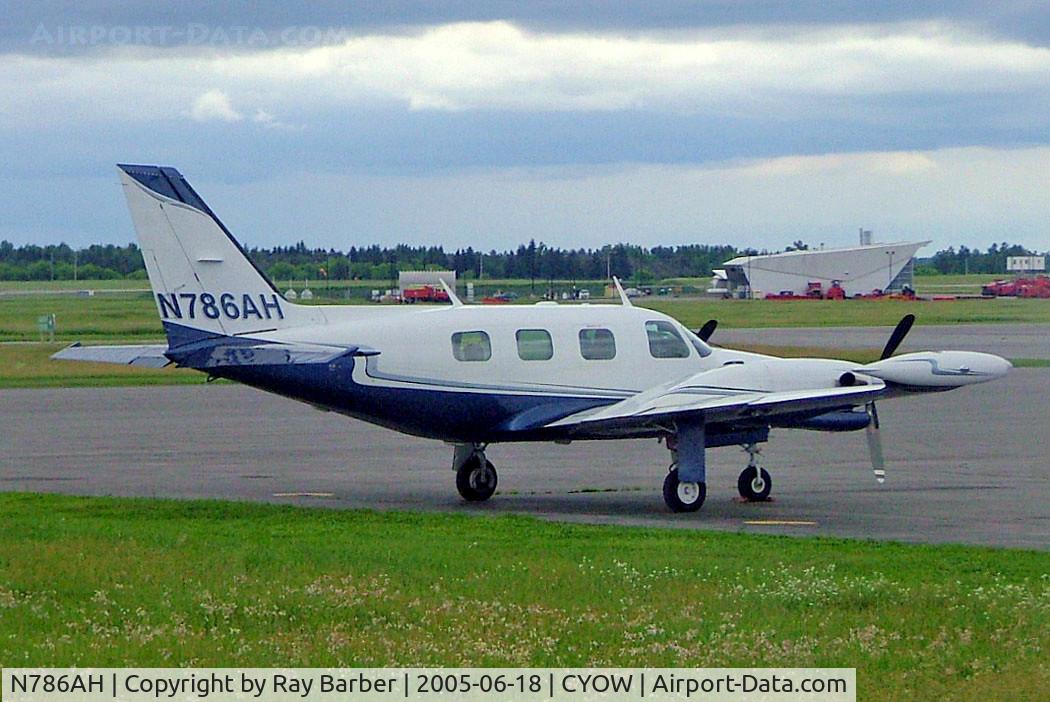 N786AH, 1978 Piper PA-31T C/N 31T-7820053, Piper PA-31T Cheyenne II [31T-7820053] Ottawa-Macdonald Cartier International~C 18/06/2005.  Taken through glass on coach whilst moving.