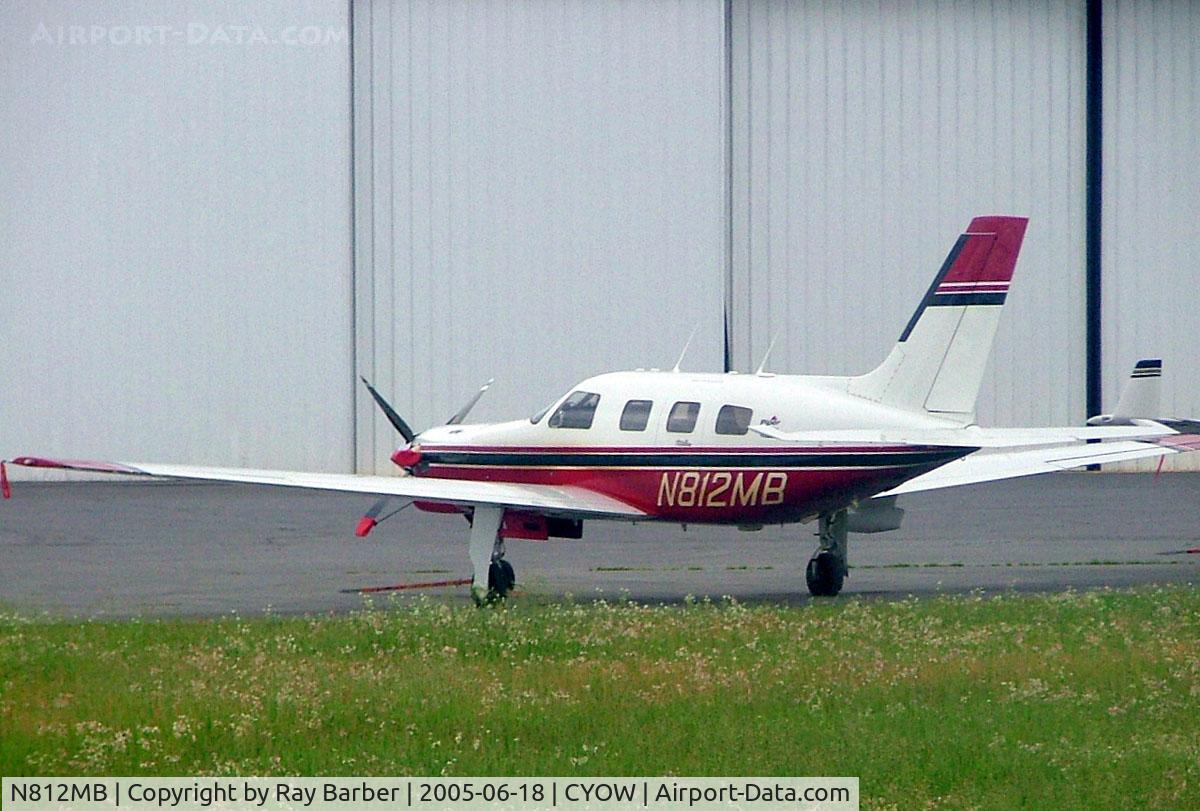 N812MB, 1997 Piper PA-46-350P Malibu Mirage C/N 4636111, Piper PA-46-350P Malibu Mirage JetPROP DLX [4636111] Ottawa-Macdonald Cartier International~C 18/06/2005. Taken through glass on coach whilst moving.