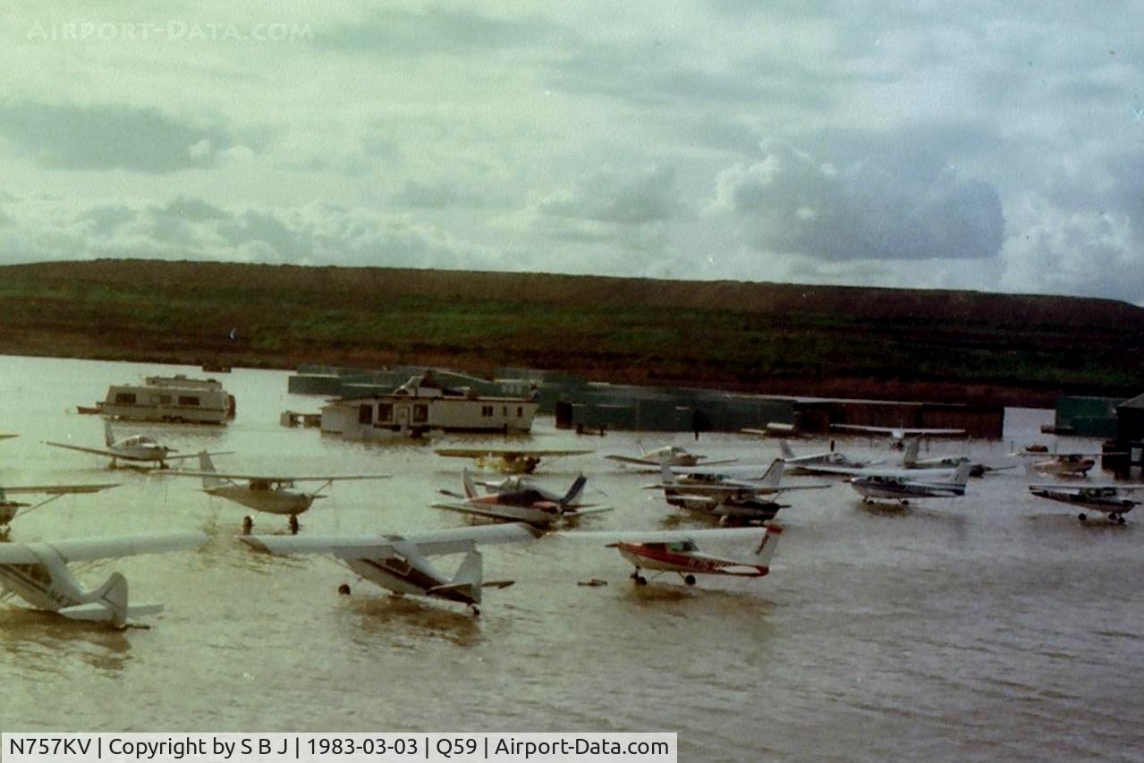 N757KV, 1977 Cessna 152 C/N 15279809, 7KV at the Fremont airport in Calif. around 1983 when the airport was a little wet. It is the red & white 152.It was exported to Mexico in 2005.That large hill you see is a landfill (garbage) facility.It was a Fremont airport landmark.