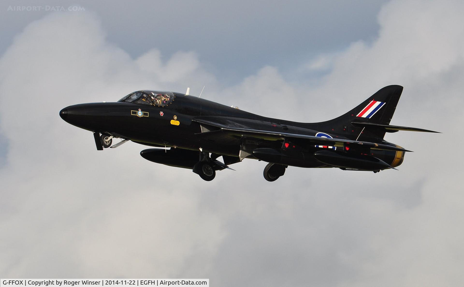 G-FFOX, 1955 Hawker Hunter T.7B C/N 41H-670792, Hunter T.7A cleaniing up after making a low pass over Runway 22. Carrying the s/n WV318 and in the 'Black Arrows' colour scheme carried by aircraft of 111 Squadron RAF between 1956 and 1960. Based at Cranfield Airport, Bedfordshire.