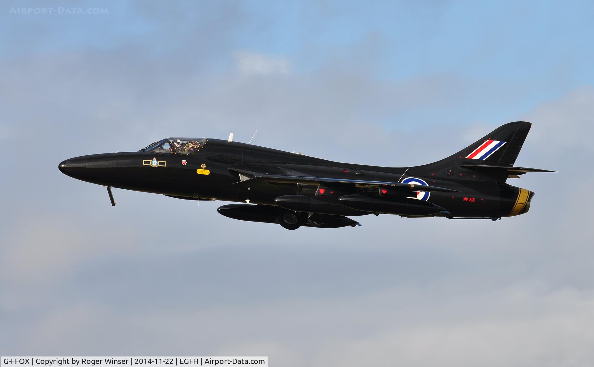G-FFOX, 1955 Hawker Hunter T.7B C/N 41H-670792, Hunter T.7A cleaning up after a low pass over Runway 22. Carrying the s/n WV318 and in the 'Black Arrows' colour scheme carried by aircraft of 111 Squadron RAF between 1956 and 1960. Based at Cranfield Airport, Bedfordshire.